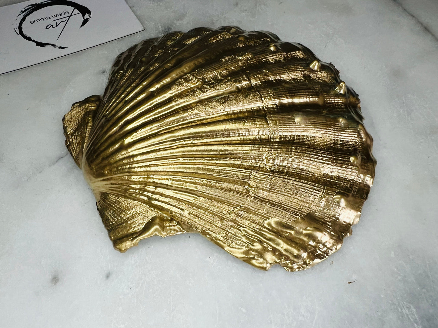 Extra large hand-painted Dorset scallop shell trinket dish featuring deep blue ocean-inspired resin artwork with turquoise wave details, hand gilded gold edging, glossy coastal jewellery holder and luxury seaside décor