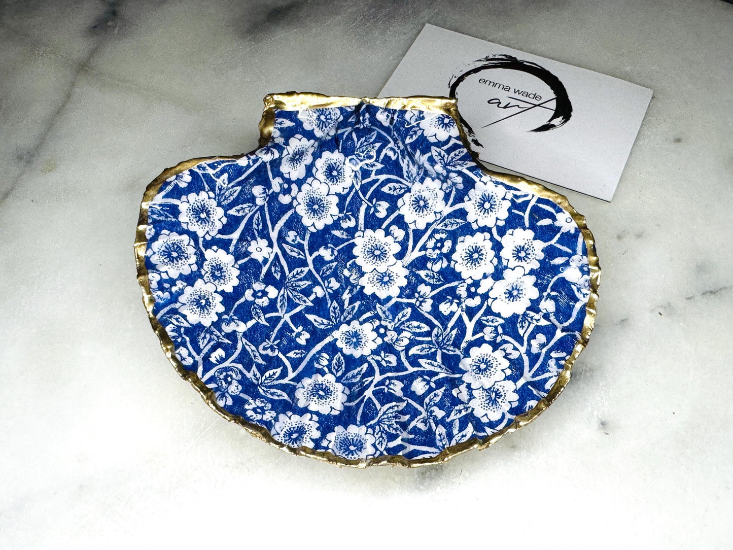 blue and white floral scallop shell dish, Dorset handmade oyster shell jewellery holder, gold leaf scallop shell trinket dish, coastal ring holder dish, sustainable scallop shell ornament, artisan jewellery dish UK, scallop shell salt and pepper pinch pot, floral scallop shell vanity tray, handmade scallop shell gift for her, blue and white coastal home decor dish, unique Dorset scallop shell trinket storage, hand gilded scallop shell decorative dish, UK handmade artisan shell gift