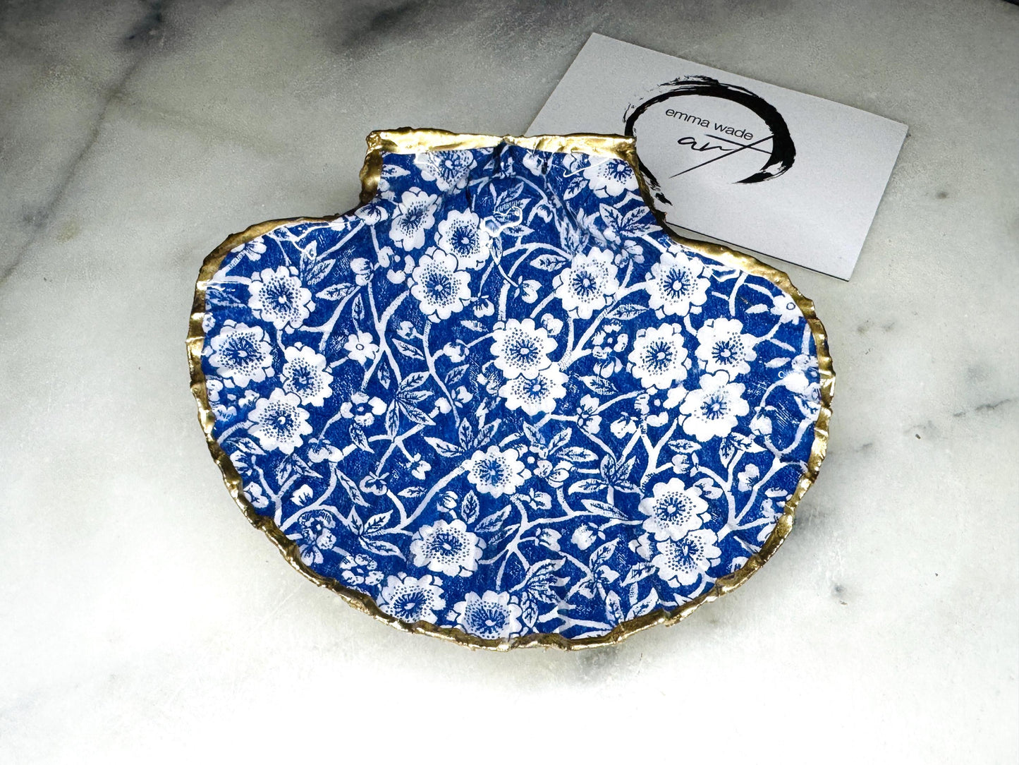 blue and white floral scallop shell dish, Dorset handmade oyster shell jewellery holder, gold leaf scallop shell trinket dish, coastal ring holder dish, sustainable scallop shell ornament, artisan jewellery dish UK, scallop shell salt and pepper pinch pot, floral scallop shell vanity tray, handmade scallop shell gift for her, blue and white coastal home decor dish, unique Dorset scallop shell trinket storage, hand gilded scallop shell decorative dish, UK handmade artisan shell gift