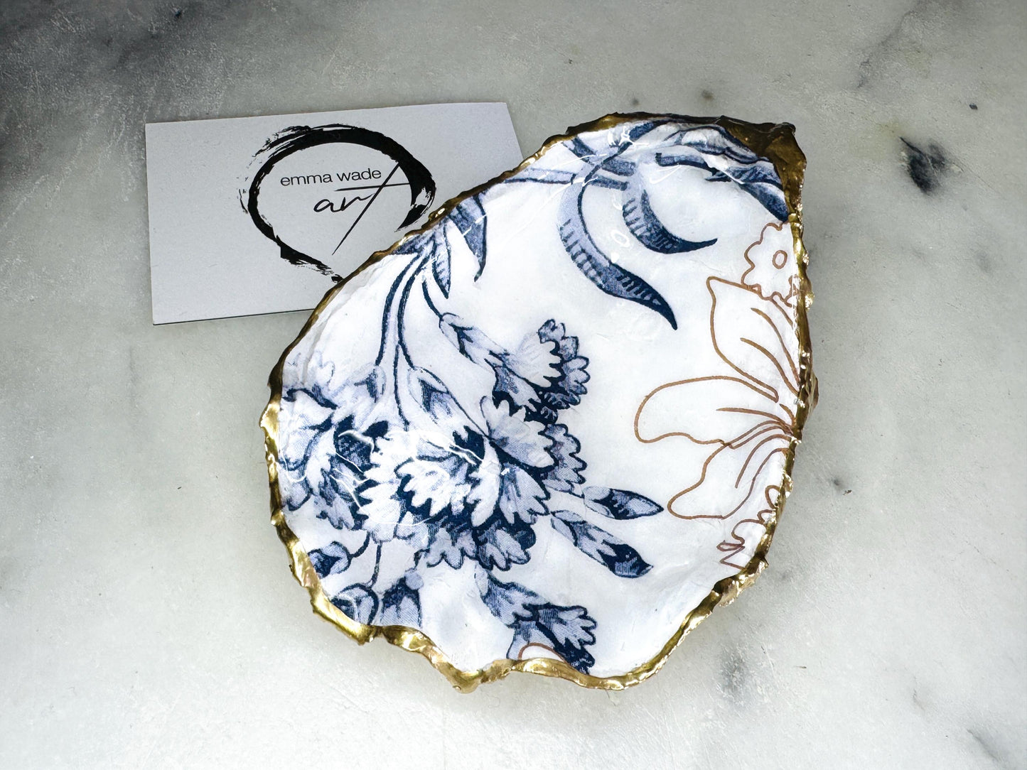 blue white Palmers print oyster shell dish, Dorset oyster shell trinket dish, gold leaf gilded oyster shell jewellery holder, handmade coastal oyster shell decor, sustainable oyster shell ornament, oyster shell bathroom tray, oyster shell salt and pepper pinch pot, oyster shell sugar dish, oyster shell spoon rest, floral oyster shell wedding gift, oyster shell Christmas present, eco friendly oyster shell art, oyster shell keepsake, unique handmade oyster shell gift UK