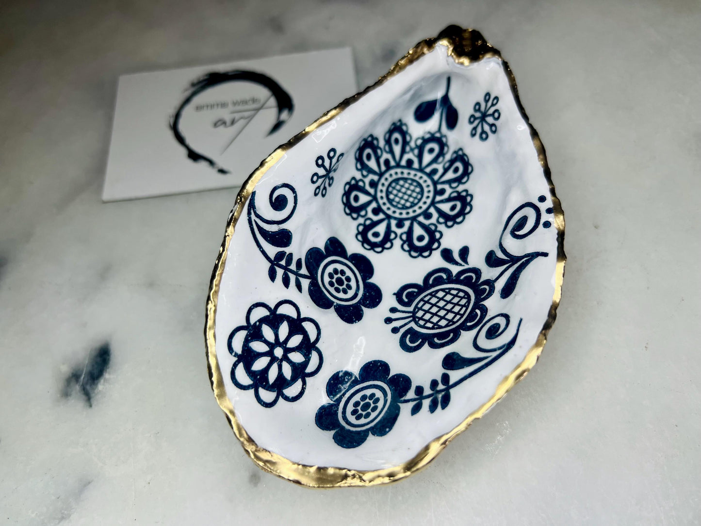 Marimekko flowers and birds oyster shell trinket dish, handmade coastal décor, Dorset shell jewellery holder, gold leaf gilded ornament, unique ocean-inspired gift, oyster shell ring dish, wedding favour, anniversary gift, handmade eco-friendly shell bowl, nautical bathroom accessory, salt and pepper pinch pot, tea light holder, sustainable oyster shell art, luxury coastal tableware, perfect gift for nature and design lovers.