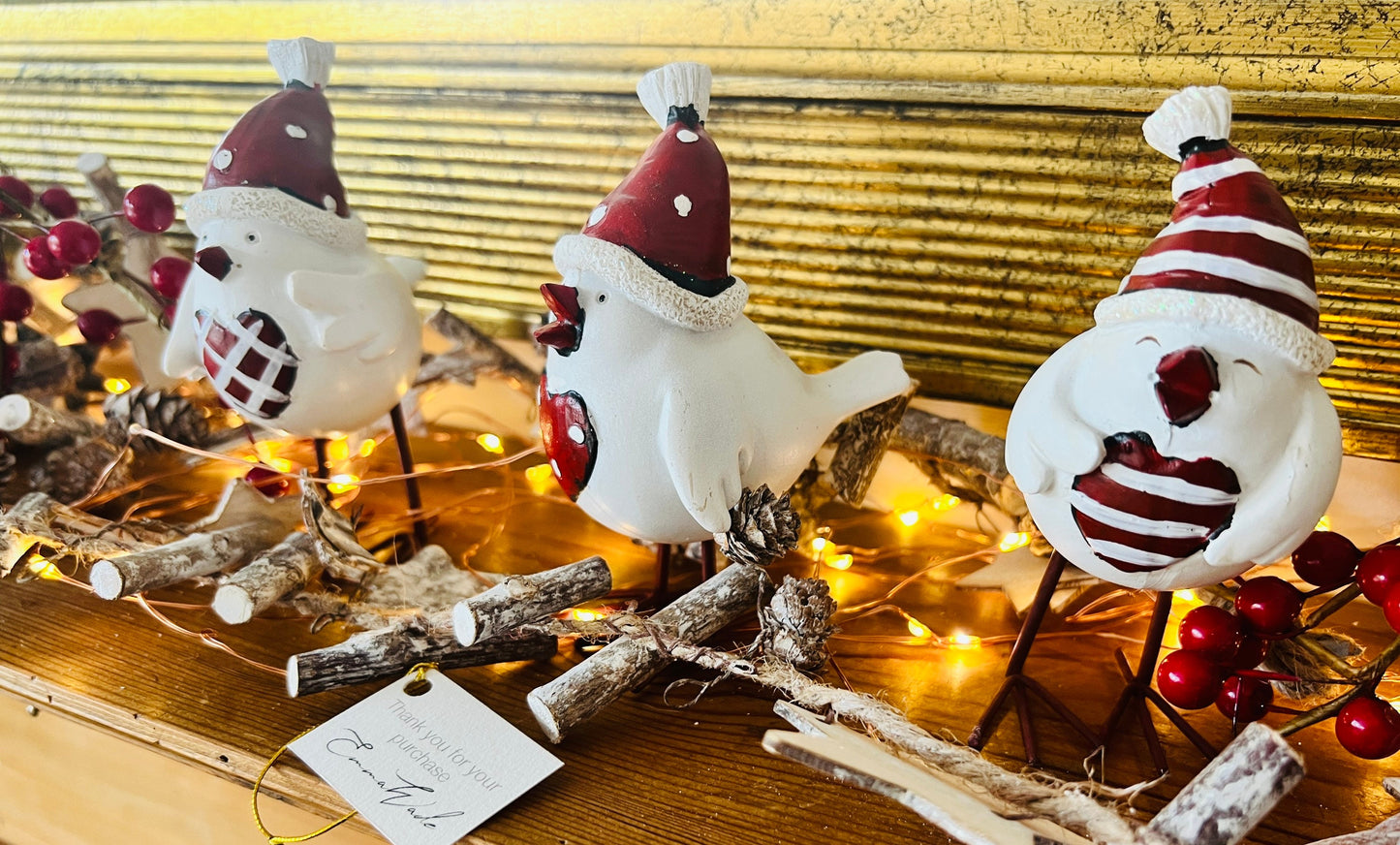 Set of three hand finished robin Christmas ornaments with festive hats, scarves and red heart details. Rustic woodland style bird decorations in cream, burgundy and red tones, perfect for Christmas tree décor, festive styling and stocking filler gifts.