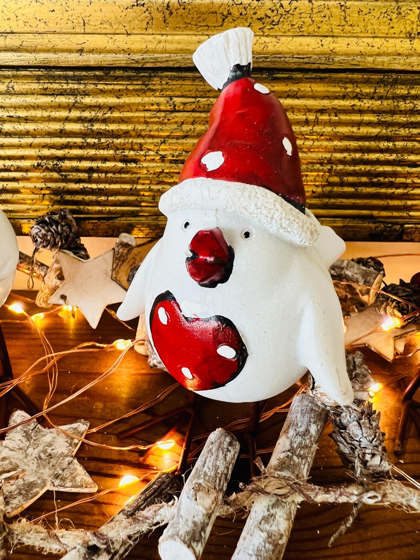 Set of three hand finished robin Christmas ornaments with festive hats, scarves and red heart details. Rustic woodland style bird decorations in cream, burgundy and red tones, perfect for Christmas tree décor, festive styling and stocking filler gifts.