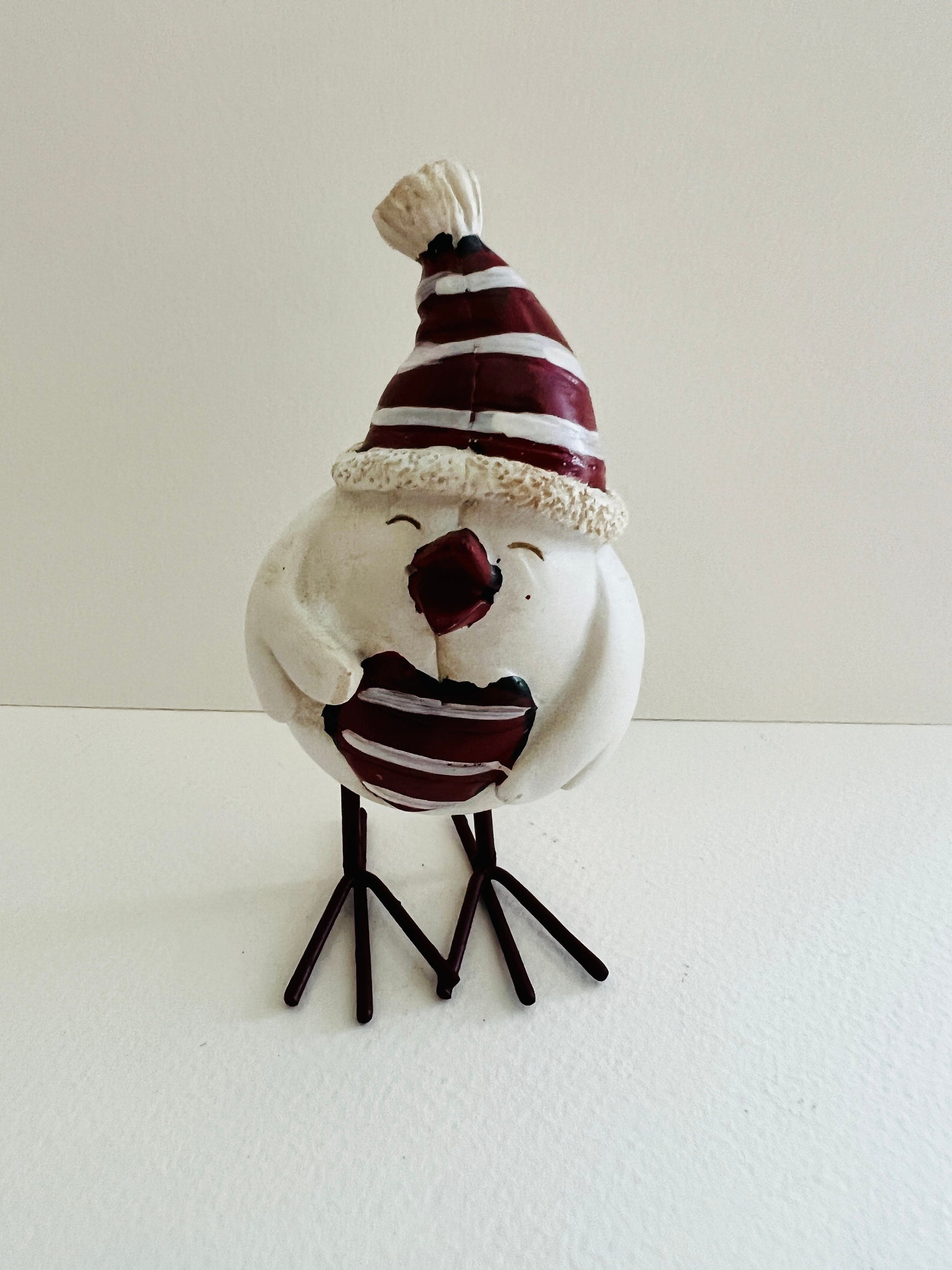Set of three hand finished robin Christmas ornaments with festive hats, scarves and red heart details. Rustic woodland style bird decorations in cream, burgundy and red tones, perfect for Christmas tree décor, festive styling and stocking filler gifts.