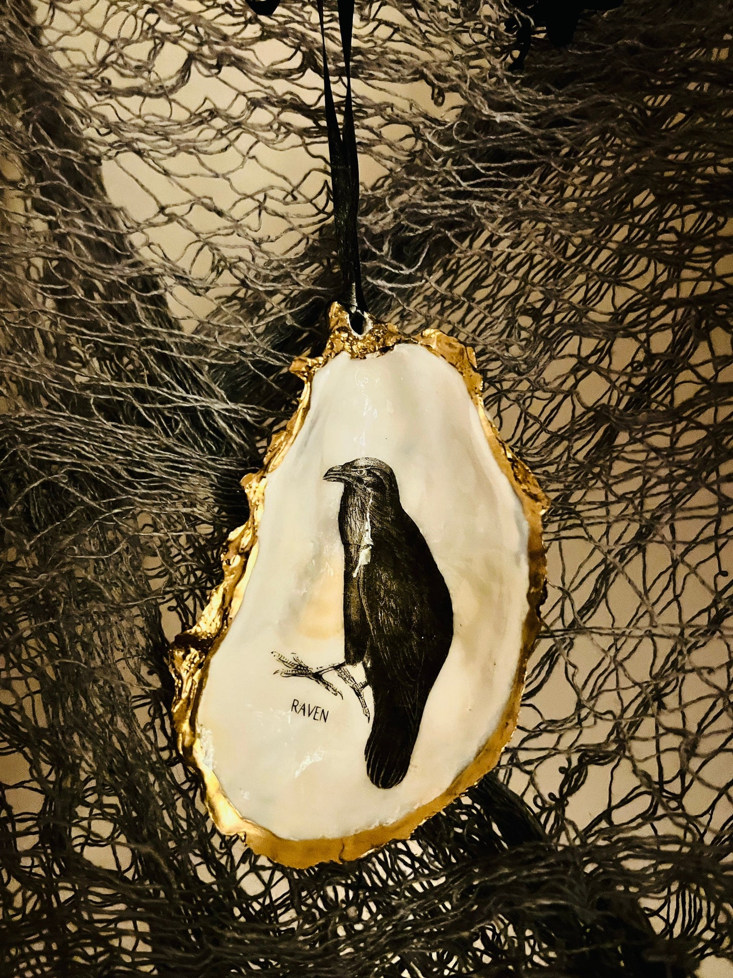 gothic ornaments, halloween oyster shell, gilded oyster hanging ornaments, coastal gothic decor, gothic christmas ornament, skull oyster shell decoration, pumpkin oyster shell ornament, raven oyster shell hanging decor, spooky oyster shell trinket dish, gothic halloween tree ornament, handmade gothic oyster shell gift, oyster shell gothic home accessory, dark gothic oyster shell decor, halloween oyster shell candy dish, gothic oyster shell jewellery holder, handmade oyster art UK