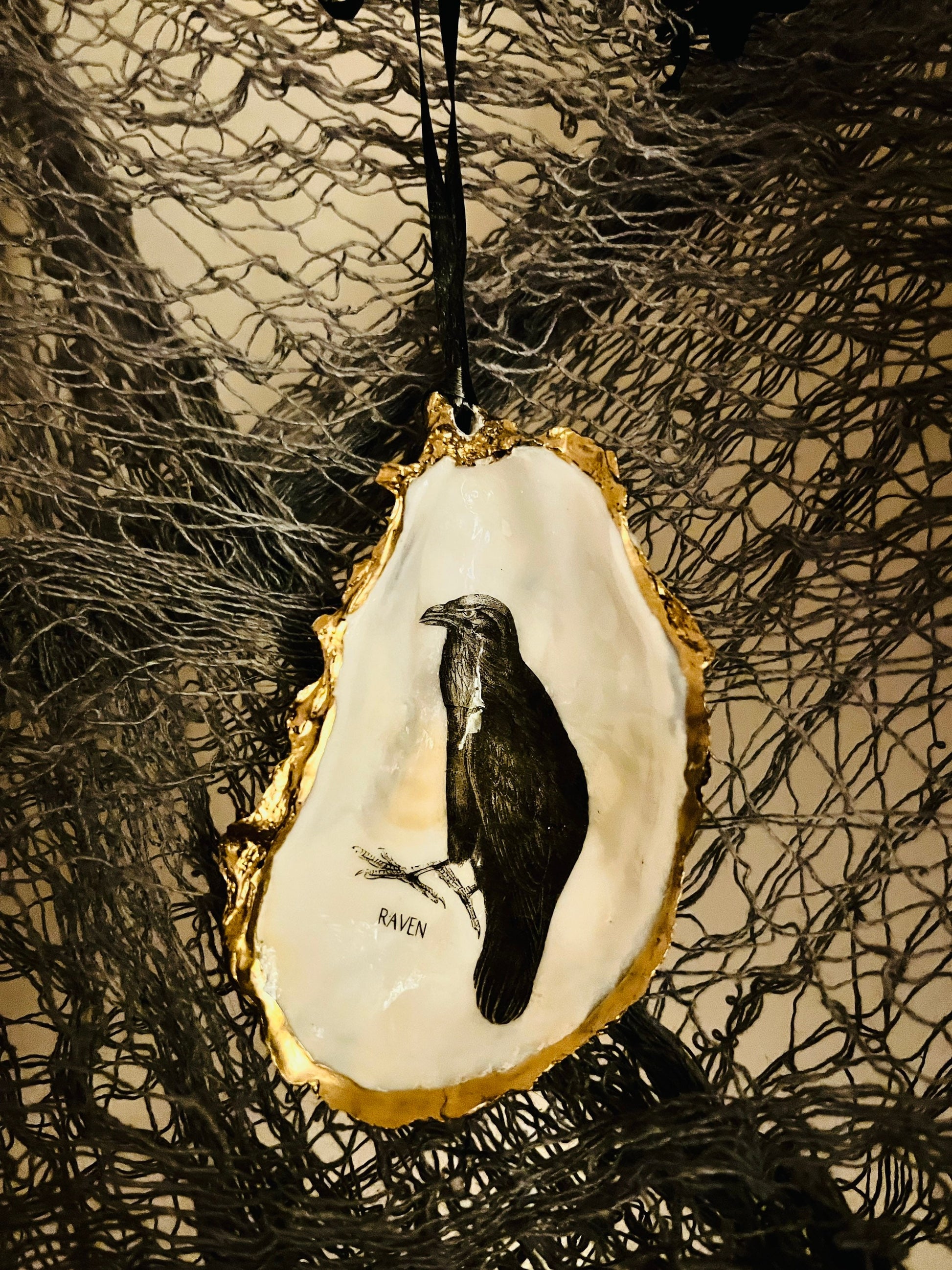 gothic ornaments, halloween oyster shell, gilded oyster hanging ornaments, coastal gothic decor, gothic christmas ornament, skull oyster shell decoration, pumpkin oyster shell ornament, raven oyster shell hanging decor, spooky oyster shell trinket dish, gothic halloween tree ornament, handmade gothic oyster shell gift, oyster shell gothic home accessory, dark gothic oyster shell decor, halloween oyster shell candy dish, gothic oyster shell jewellery holder, handmade oyster art UK