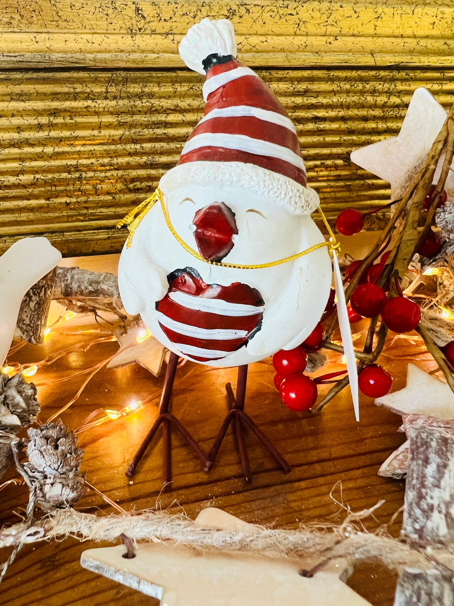 Set of three hand finished robin Christmas ornaments with festive hats, scarves and red heart details. Rustic woodland style bird decorations in cream, burgundy and red tones, perfect for Christmas tree décor, festive styling and stocking filler gifts.