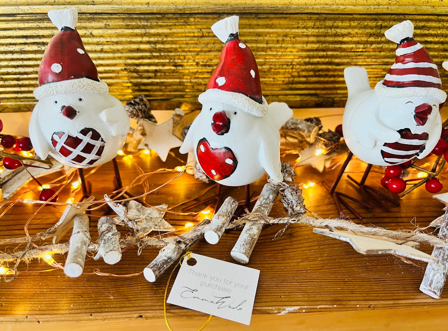 Set of three hand finished robin Christmas ornaments with festive hats, scarves and red heart details. Rustic woodland style bird decorations in cream, burgundy and red tones, perfect for Christmas tree décor, festive styling and stocking filler gifts.