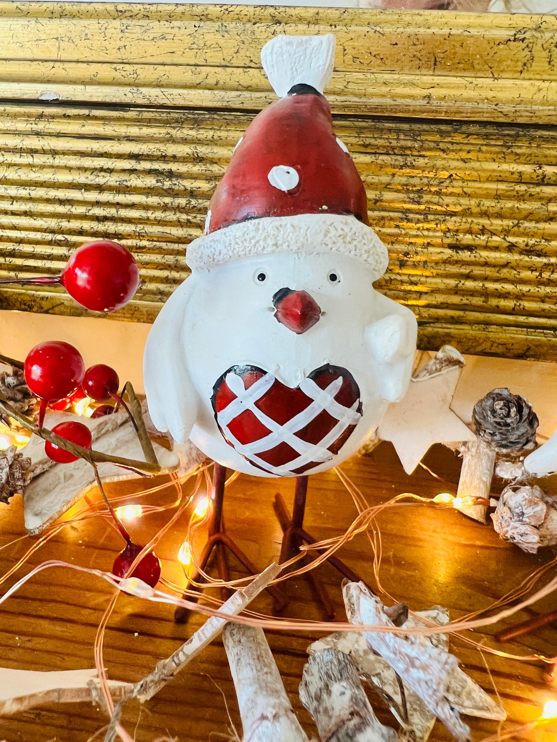 Set of three hand finished robin Christmas ornaments with festive hats, scarves and red heart details. Rustic woodland style bird decorations in cream, burgundy and red tones, perfect for Christmas tree décor, festive styling and stocking filler gifts.