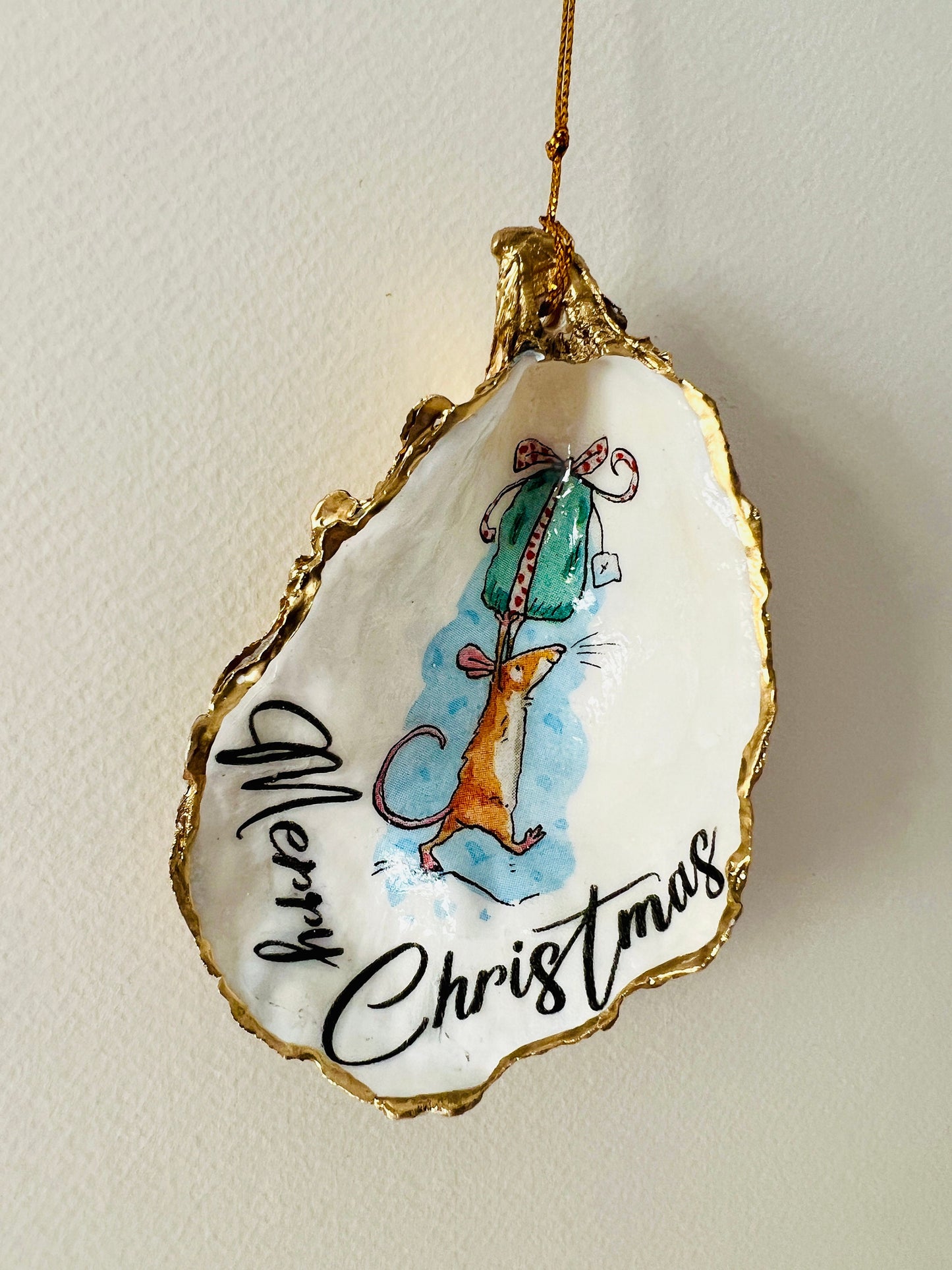 Handmade Christmas mouse oyster shell ornament. Dorset oyster shell trinket dish gilded with real gold leaf and sealed with resin. Use as festive candy dish, jewellery holder, or hanging Christmas tree ornament. Unique eco-friendly oyster shell gift, stocking filler, or table decoration. Coastal holiday décor, perfect handmade UK Christmas present, anniversary or winter wedding favour, individually crafted from natural Dorset shells.