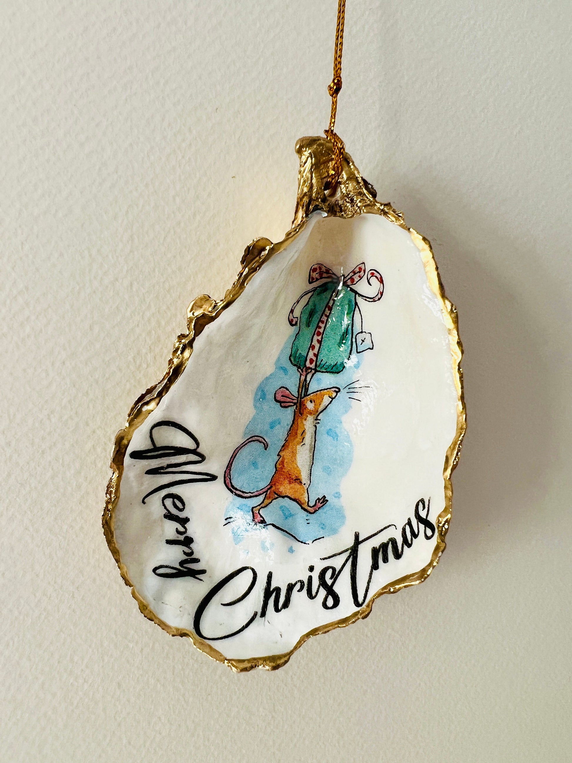 Handmade Christmas mouse oyster shell ornament. Dorset oyster shell trinket dish gilded with real gold leaf and sealed with resin. Use as festive candy dish, jewellery holder, or hanging Christmas tree ornament. Unique eco-friendly oyster shell gift, stocking filler, or table decoration. Coastal holiday décor, perfect handmade UK Christmas present, anniversary or winter wedding favour, individually crafted from natural Dorset shells.