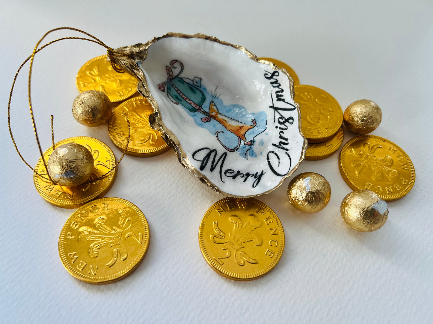 Handmade Christmas mouse oyster shell ornament. Dorset oyster shell trinket dish gilded with real gold leaf and sealed with resin. Use as festive candy dish, jewellery holder, or hanging Christmas tree ornament. Unique eco-friendly oyster shell gift, stocking filler, or table decoration. Coastal holiday décor, perfect handmade UK Christmas present, anniversary or winter wedding favour, individually crafted from natural Dorset shells.