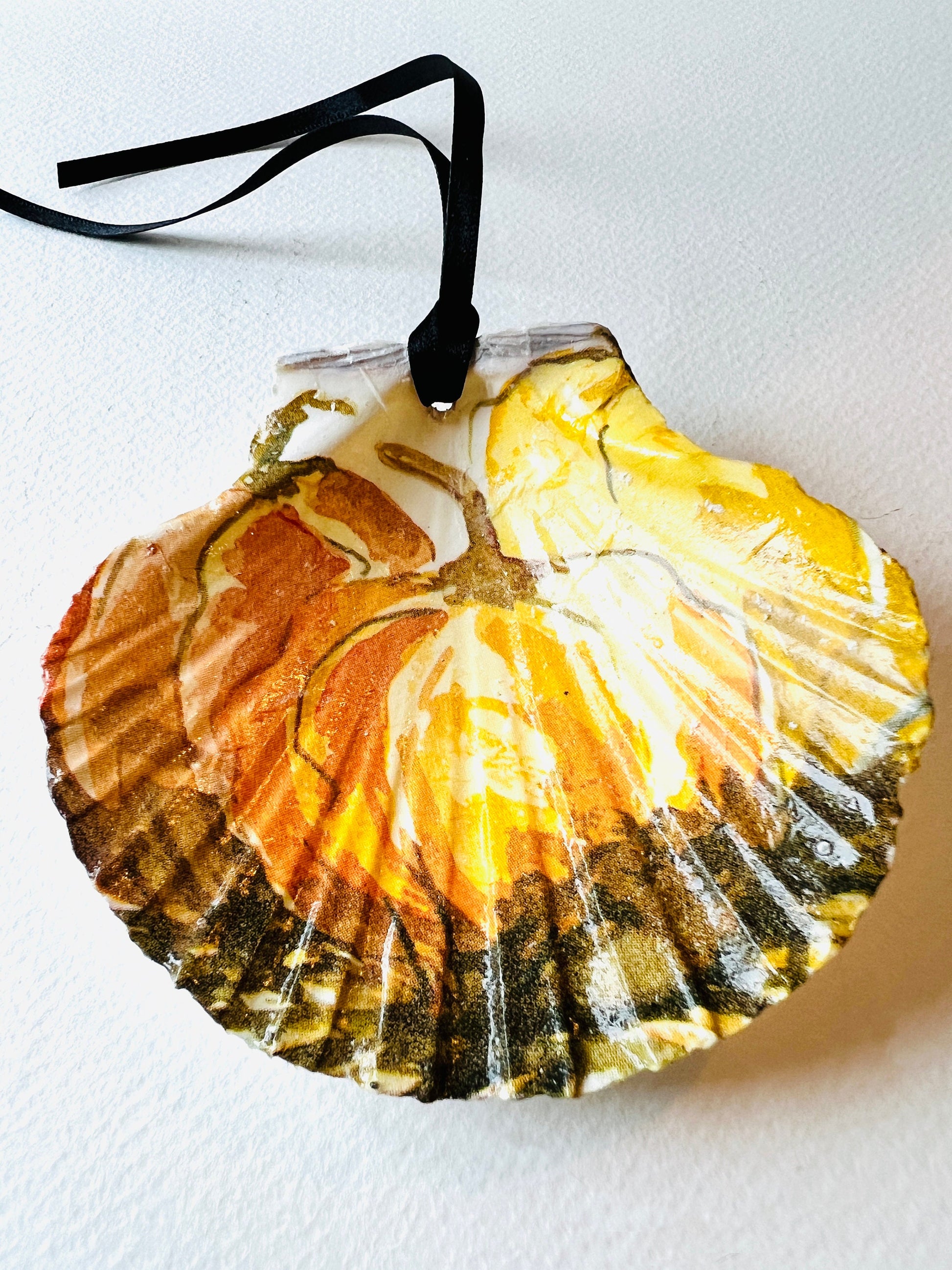 Pumpkin Halloween scallop shell ring dish, handmade Dorset scallop ring holder, jewellery trinket dish, autumn coastal décor, gothic pumpkin ornament, eco-friendly scallop shell bowl, gold leaf gilded shell, Halloween gift idea, seasonal table decoration, unique handmade scallop ornament, sustainable shell art, fall home accessory, spooky candy dish, rustic coastal pumpkin décor, artisan trinket holder, scallop shell jewellery storage, handmade ring dish and candy bowl.