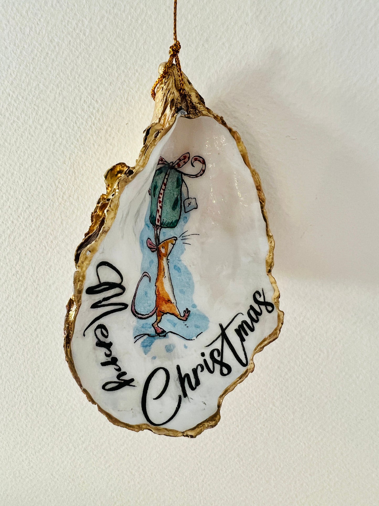 Handmade Christmas mouse oyster shell ornament. Dorset oyster shell trinket dish gilded with real gold leaf and sealed with resin. Use as festive candy dish, jewellery holder, or hanging Christmas tree ornament. Unique eco-friendly oyster shell gift, stocking filler, or table decoration. Coastal holiday décor, perfect handmade UK Christmas present, anniversary or winter wedding favour, individually crafted from natural Dorset shells.