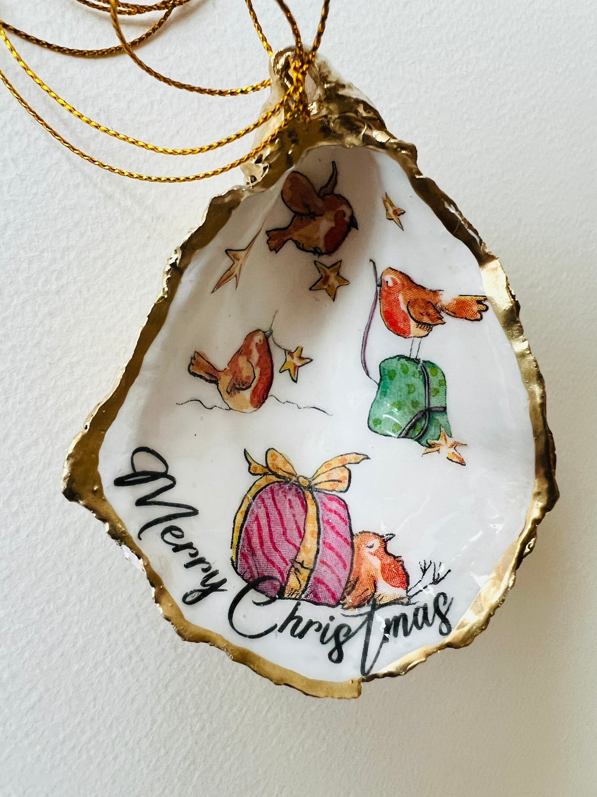 Robin bird oyster shell ornament, handmade in Dorset and gilded with liquid gold leaf. Unique coastal Christmas tree decoration or stocking filler. Can be used as a trinket dish, candy dish, or jewellery holder. Perfect bird lover gift, rustic festive ornament, eco-friendly holiday décor, oyster shell Christmas gift, handmade UK artisan bird decoration, coastal nature inspired home décor, robin bird keepsake.
