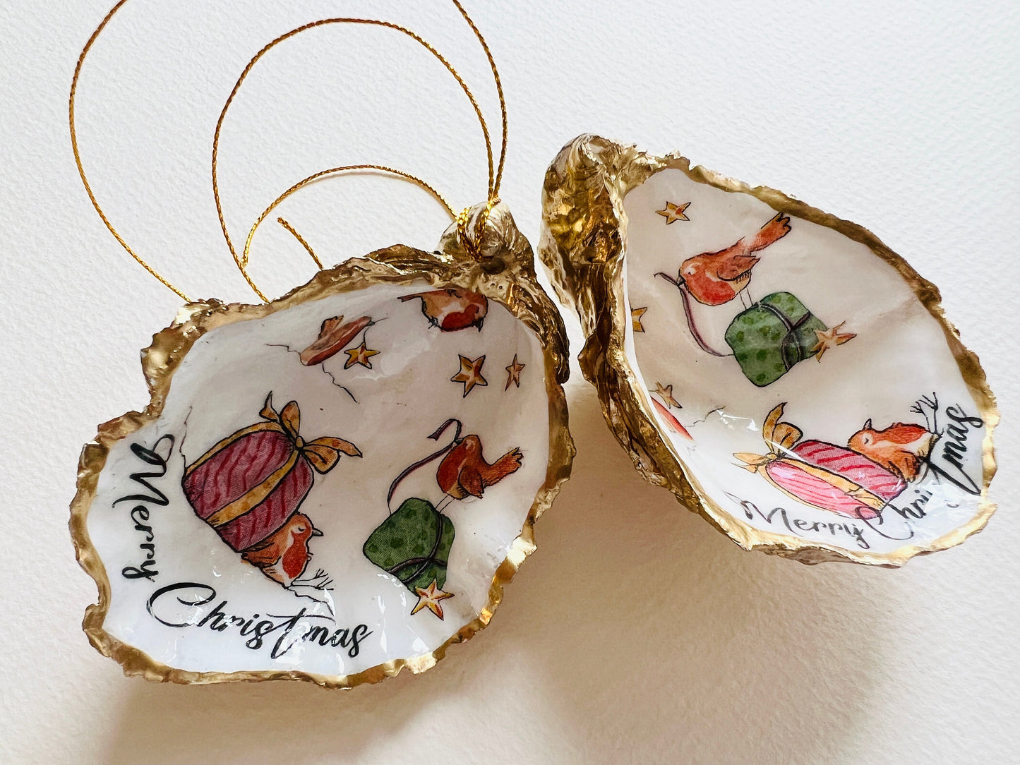 Robin bird oyster shell ornament, handmade in Dorset and gilded with liquid gold leaf. Unique coastal Christmas tree decoration or stocking filler. Can be used as a trinket dish, candy dish, or jewellery holder. Perfect bird lover gift, rustic festive ornament, eco-friendly holiday décor, oyster shell Christmas gift, handmade UK artisan bird decoration, coastal nature inspired home décor, robin bird keepsake.