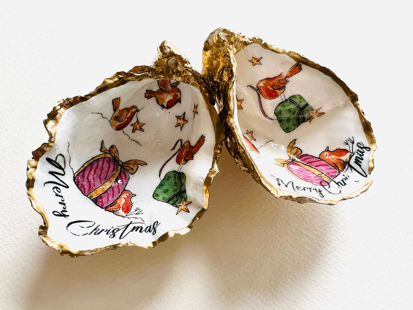Robin bird oyster shell ornament, handmade in Dorset and gilded with liquid gold leaf. Unique coastal Christmas tree decoration or stocking filler. Can be used as a trinket dish, candy dish, or jewellery holder. Perfect bird lover gift, rustic festive ornament, eco-friendly holiday décor, oyster shell Christmas gift, handmade UK artisan bird decoration, coastal nature inspired home décor, robin bird keepsake.