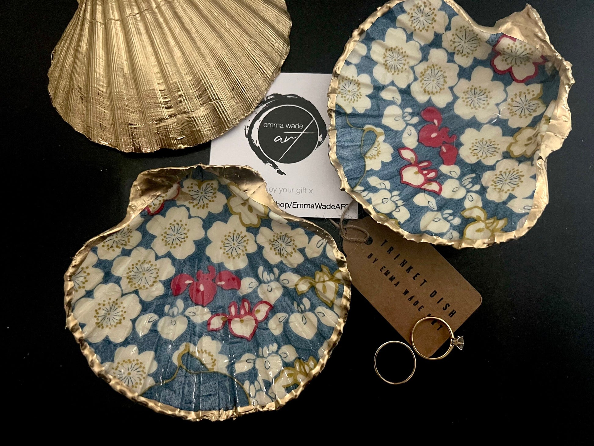 Japanese Sakura cherry blossom floral scallop shell trinket dish with blue, cream and red botanical flower design, hand finished with liquid gold leaf edging and glossy resin. Handmade coastal jewellery tray and ring dish inspired by Japanese floral art and Dorset coastal décor.