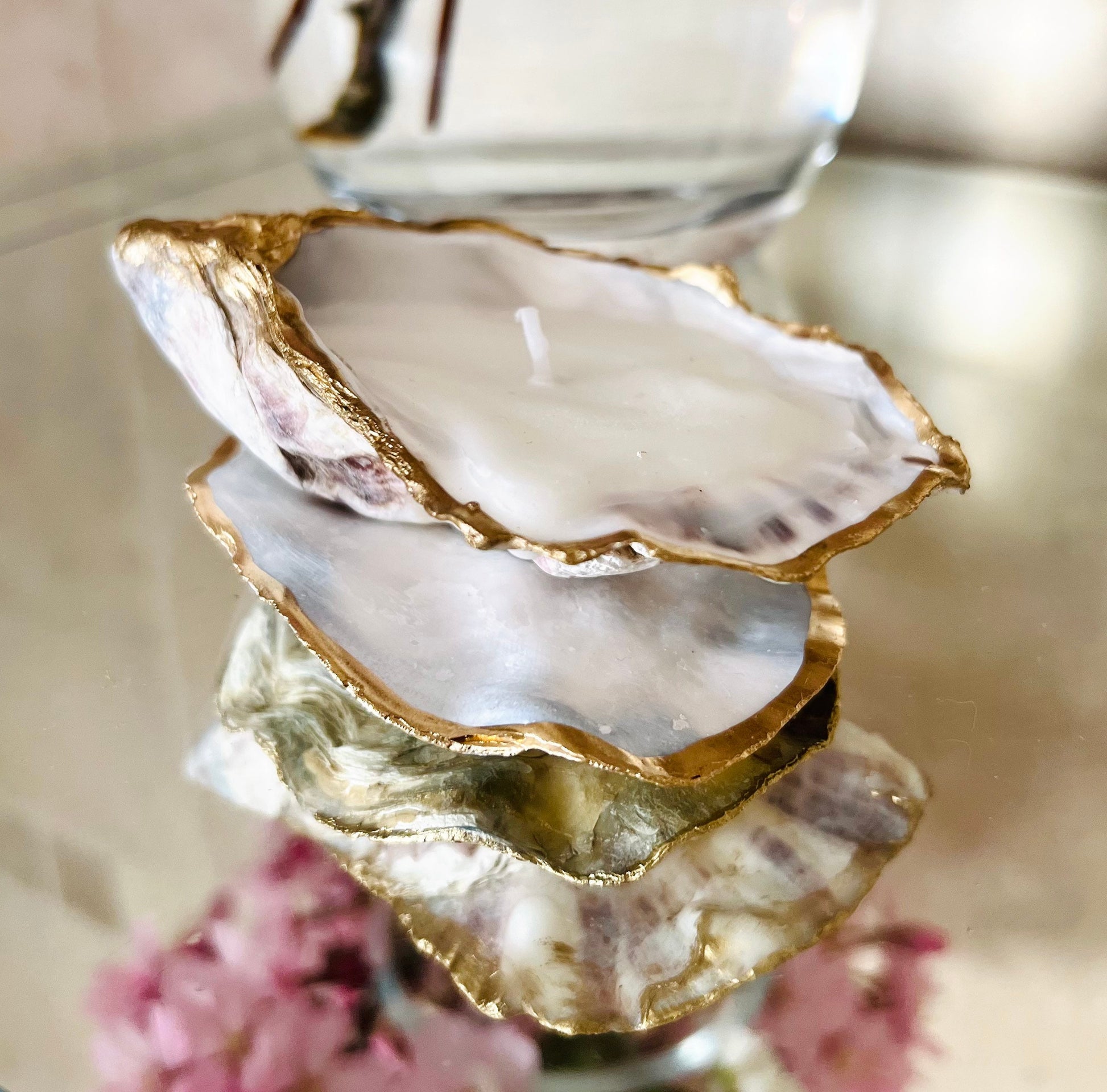 oyster shell candle, gold oyster candle, gilded oyster shells, hand poured candle, coastal decor, ocean inspired candle, beach home decor, sustainable candle, handmade in Surrey, luxury shell candle, sea lover gift, oyster shell pair, artisan candle, eco friendly candle, gold rim shell, nautical decor, ocean gift, coastal homeware, handmade oyster shell candle, shell wedding decor, seaside candle, mother of pearl shell, gold edged candle, beach cottage style, elegant coastal gift