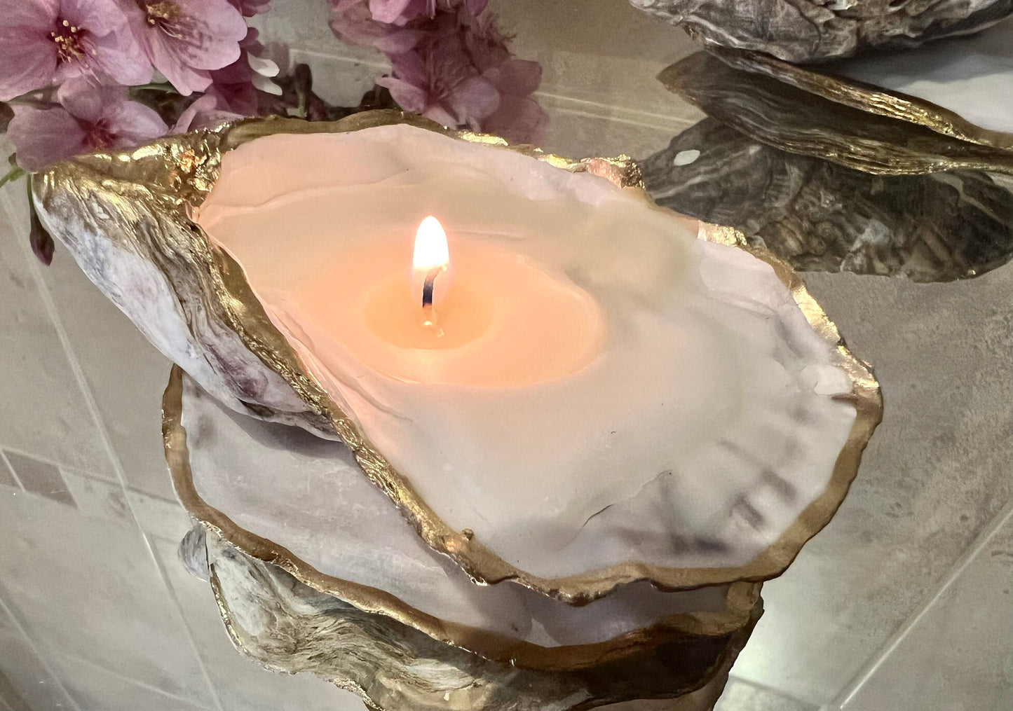 oyster shell candle, gold oyster candle, gilded oyster shells, hand poured candle, coastal decor, ocean inspired candle, beach home decor, sustainable candle, handmade in Surrey, luxury shell candle, sea lover gift, oyster shell pair, artisan candle, eco friendly candle, gold rim shell, nautical decor, ocean gift, coastal homeware, handmade oyster shell candle, shell wedding decor, seaside candle, mother of pearl shell, gold edged candle, beach cottage style, elegant coastal gift