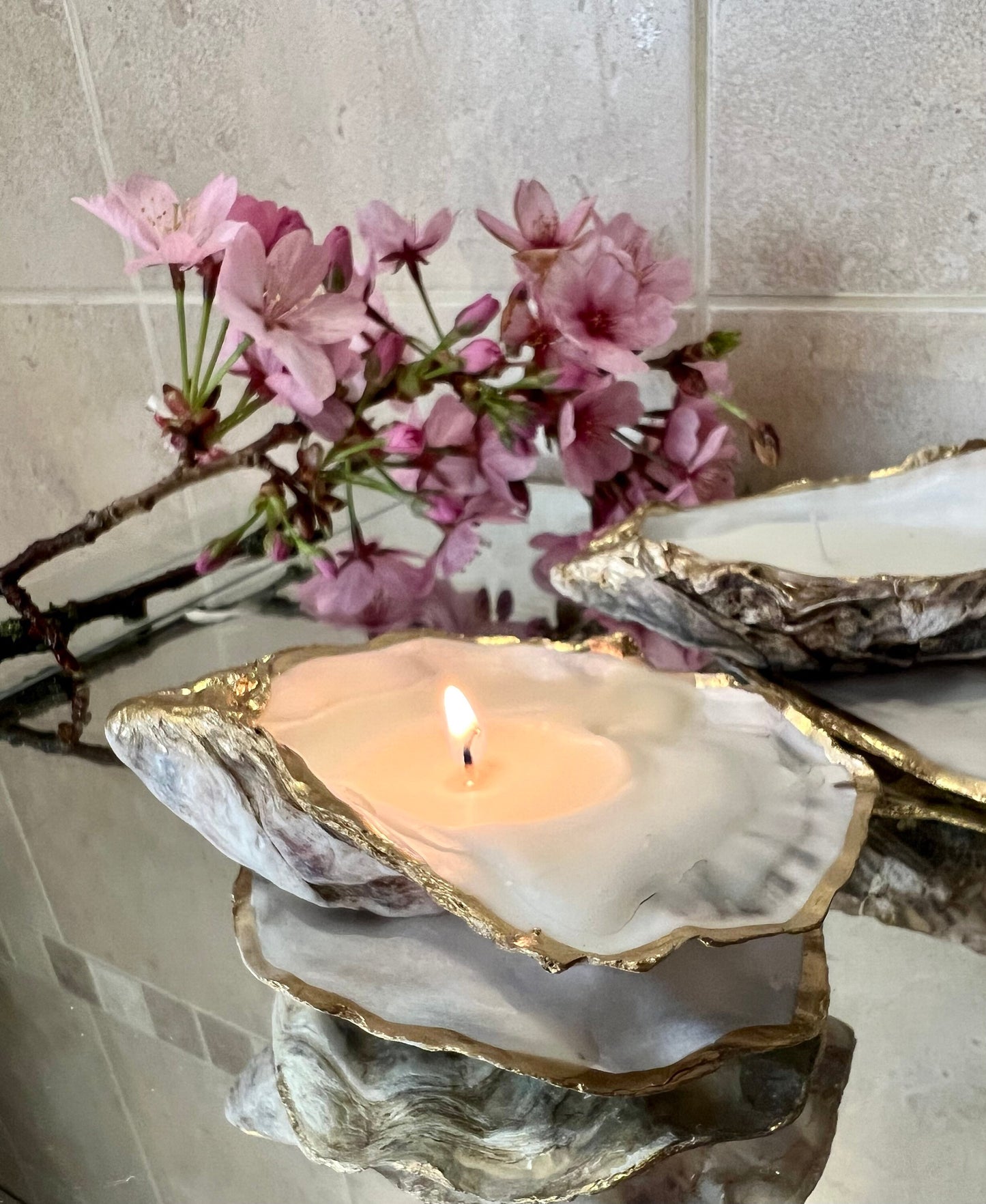oyster shell candle, gold oyster candle, gilded oyster shells, hand poured candle, coastal decor, ocean inspired candle, beach home decor, sustainable candle, handmade in Surrey, luxury shell candle, sea lover gift, oyster shell pair, artisan candle, eco friendly candle, gold rim shell, nautical decor, ocean gift, coastal homeware, handmade oyster shell candle, shell wedding decor, seaside candle, mother of pearl shell, gold edged candle, beach cottage style, elegant coastal gift