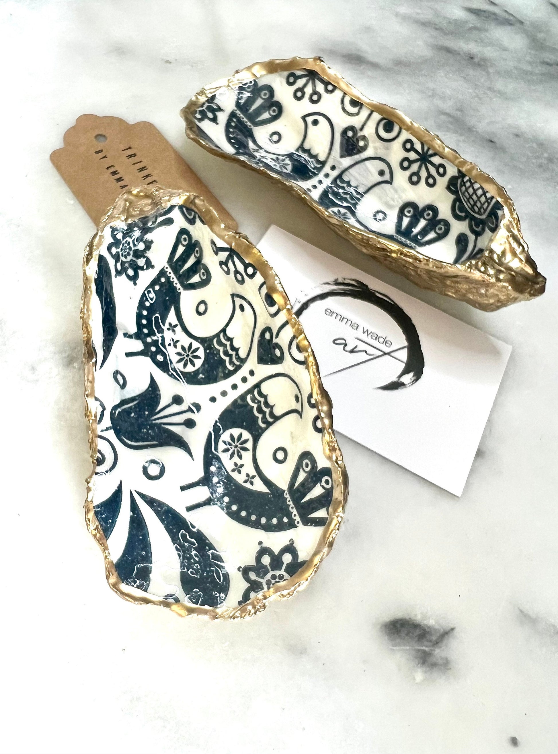 Marimekko flowers and birds oyster shell trinket dish, handmade coastal décor, Dorset shell jewellery holder, gold leaf gilded ornament, unique ocean-inspired gift, oyster shell ring dish, wedding favour, anniversary gift, handmade eco-friendly shell bowl, nautical bathroom accessory, salt and pepper pinch pot, tea light holder, sustainable oyster shell art, luxury coastal tableware, perfect gift for nature and design lovers.