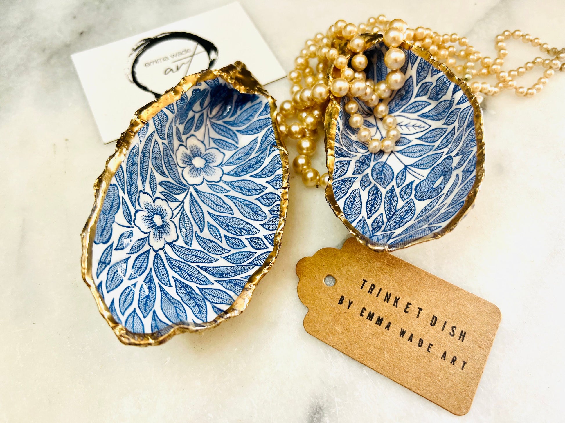 Blue flowers oyster shell trinket dish, Dorset oyster shell gift, gold leaf jewellery holder, handmade coastal decor, nautical bathroom dish, oyster shell ring holder, floral seashell trinket bowl, beach wedding favour, ocean inspired salt pinch pot, eco friendly shell gift, oyster shell spoon rest, seaside home accessory, handmade UK oyster shell dish, coastal jewellery organiser, blue floral oyster shell ornament.