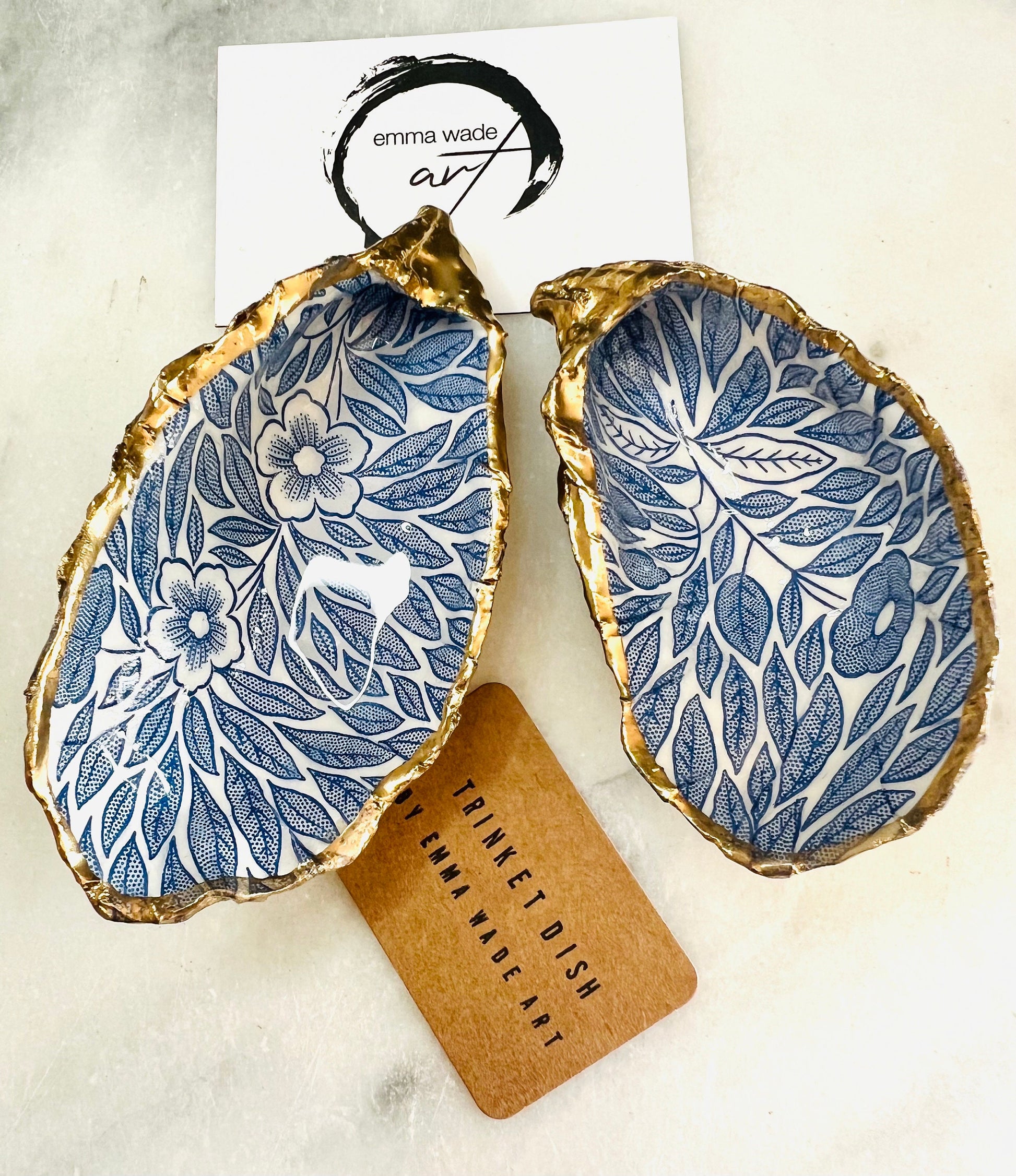 Blue flowers oyster shell trinket dish, Dorset oyster shell gift, gold leaf jewellery holder, handmade coastal decor, nautical bathroom dish, oyster shell ring holder, floral seashell trinket bowl, beach wedding favour, ocean inspired salt pinch pot, eco friendly shell gift, oyster shell spoon rest, seaside home accessory, handmade UK oyster shell dish, coastal jewellery organiser, blue floral oyster shell ornament.