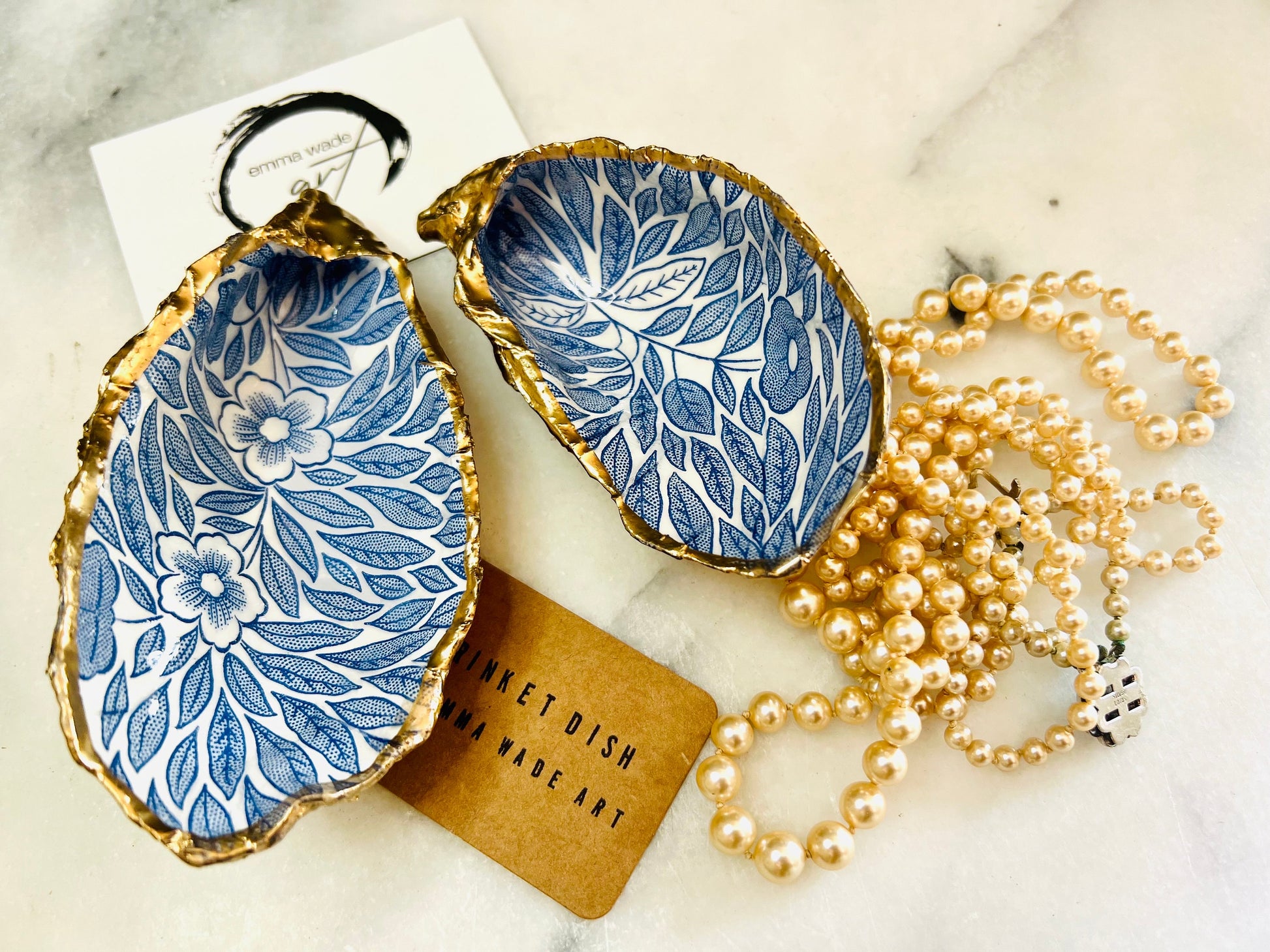 Blue flowers oyster shell trinket dish, Dorset oyster shell gift, gold leaf jewellery holder, handmade coastal decor, nautical bathroom dish, oyster shell ring holder, floral seashell trinket bowl, beach wedding favour, ocean inspired salt pinch pot, eco friendly shell gift, oyster shell spoon rest, seaside home accessory, handmade UK oyster shell dish, coastal jewellery organiser, blue floral oyster shell ornament.