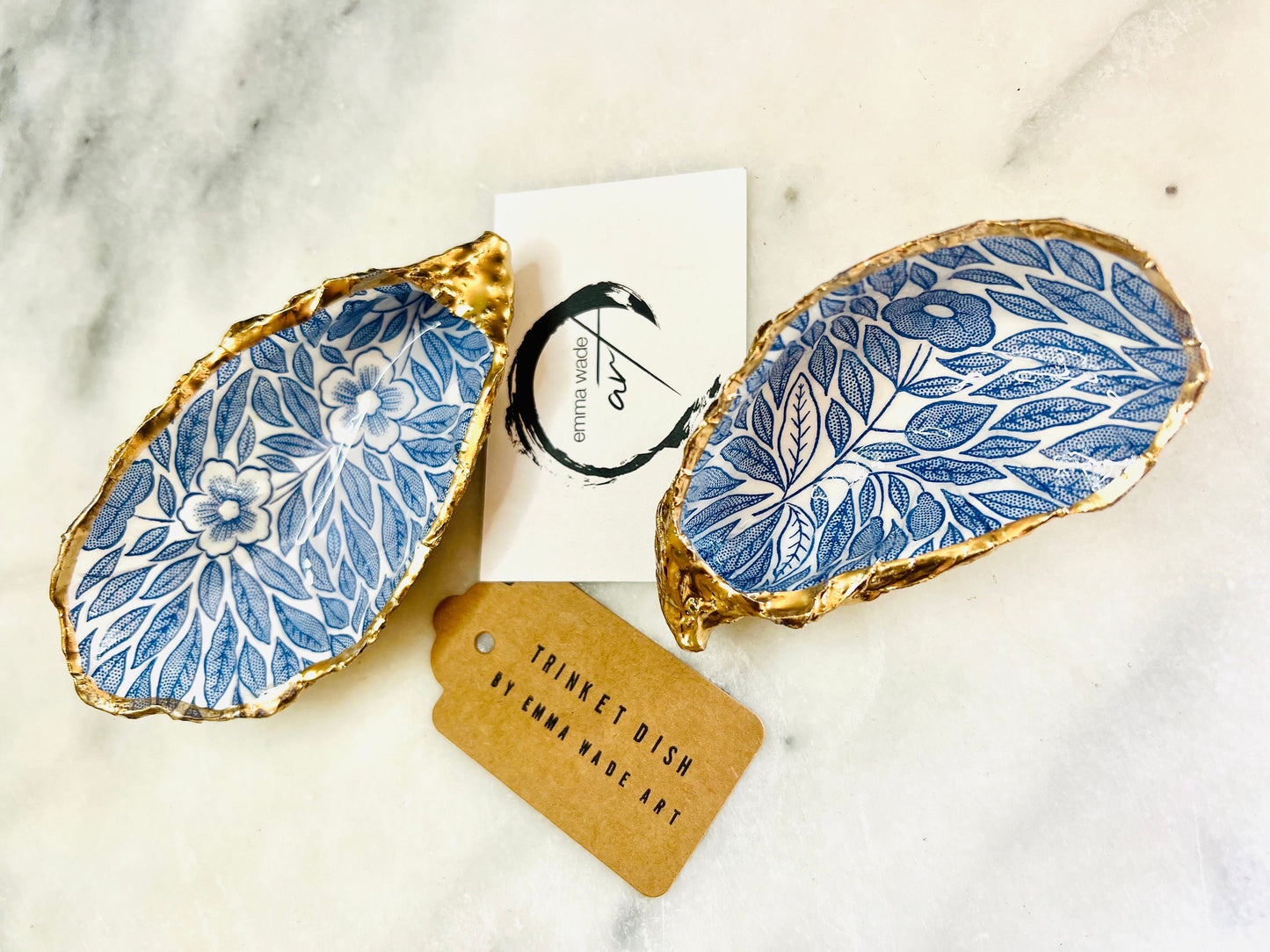 Blue flowers oyster shell trinket dish, Dorset oyster shell gift, gold leaf jewellery holder, handmade coastal decor, nautical bathroom dish, oyster shell ring holder, floral seashell trinket bowl, beach wedding favour, ocean inspired salt pinch pot, eco friendly shell gift, oyster shell spoon rest, seaside home accessory, handmade UK oyster shell dish, coastal jewellery organiser, blue floral oyster shell ornament.