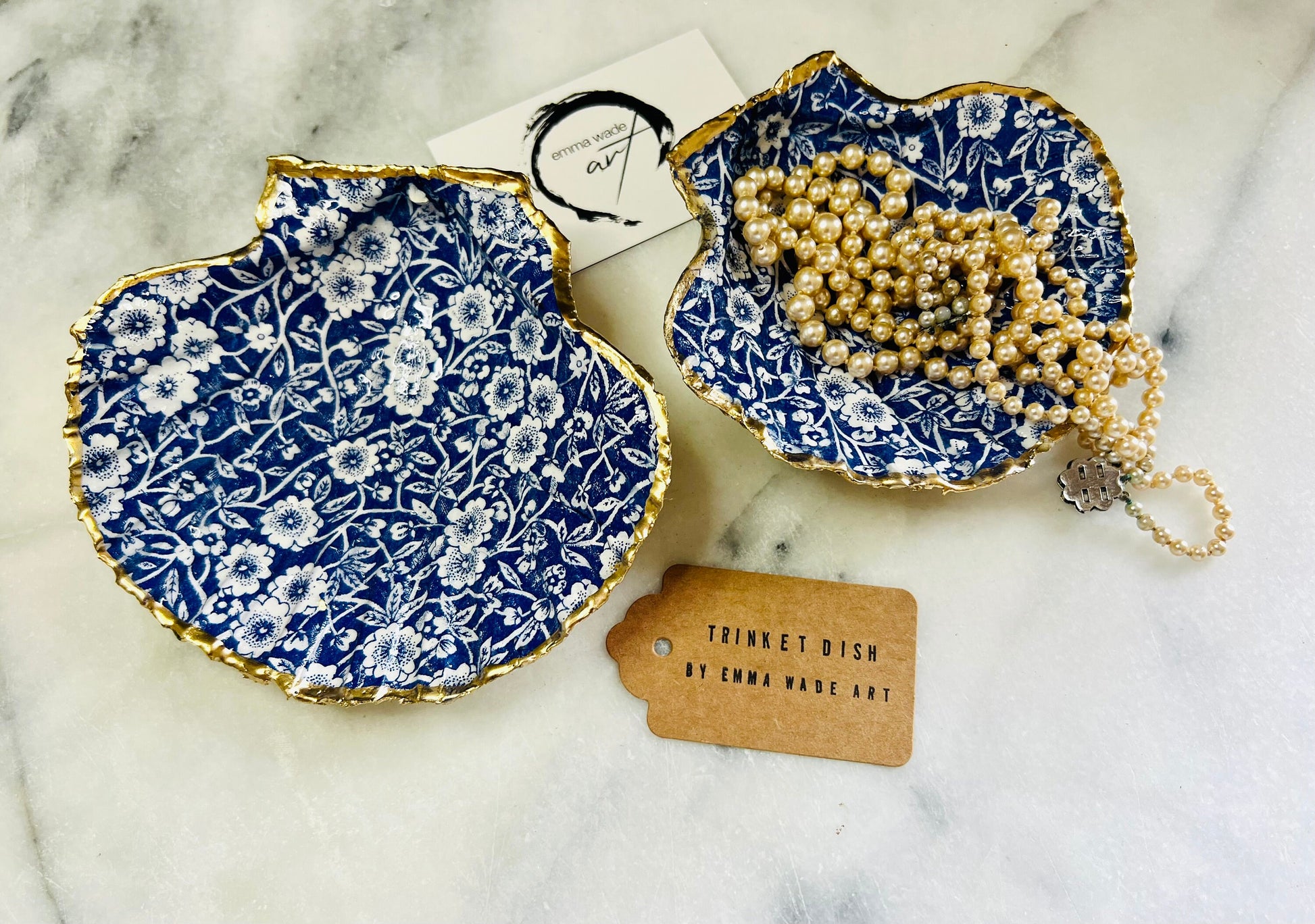 blue and white floral scallop shell dish, Dorset handmade oyster shell jewellery holder, gold leaf scallop shell trinket dish, coastal ring holder dish, sustainable scallop shell ornament, artisan jewellery dish UK, scallop shell salt and pepper pinch pot, floral scallop shell vanity tray, handmade scallop shell gift for her, blue and white coastal home decor dish, unique Dorset scallop shell trinket storage, hand gilded scallop shell decorative dish, UK handmade artisan shell gift