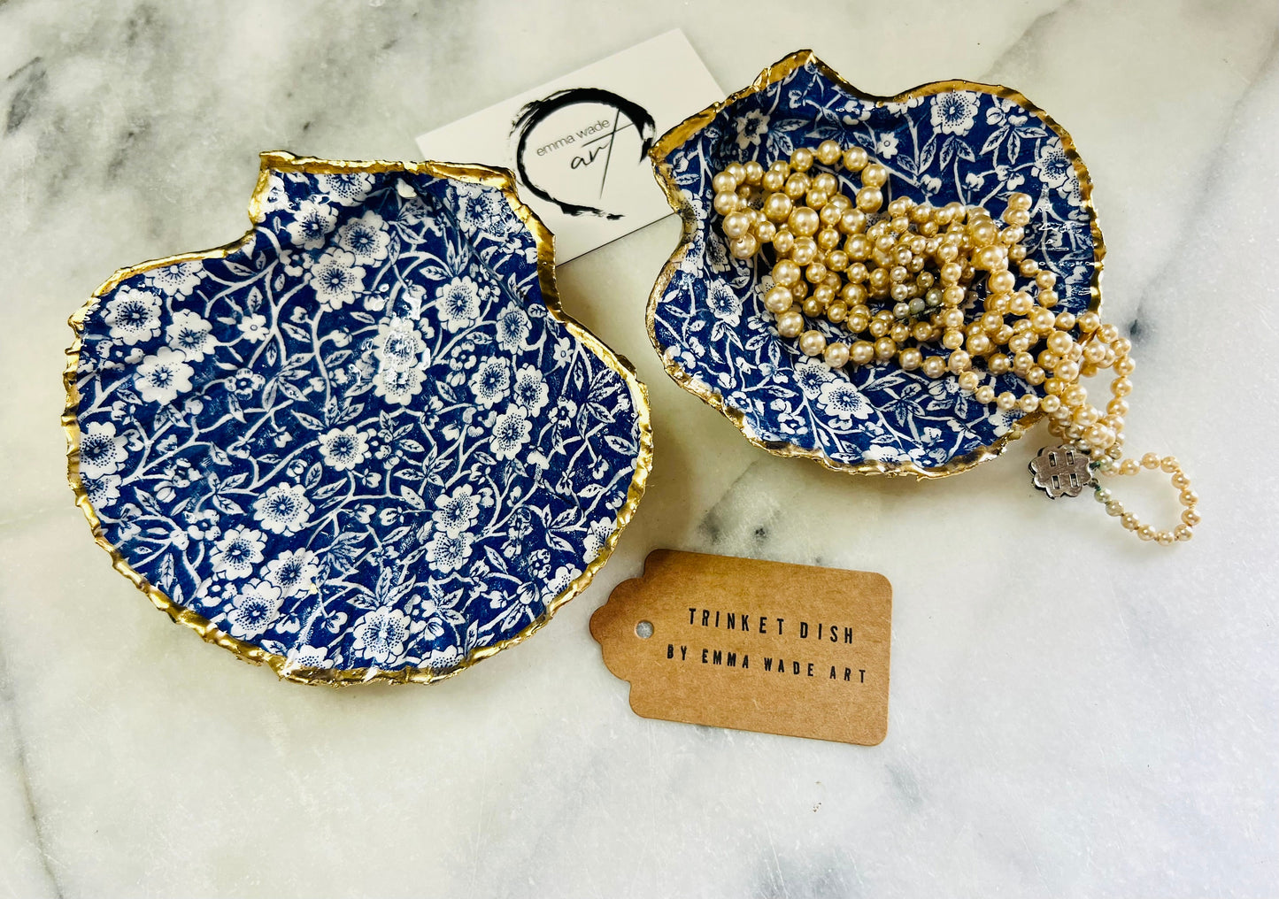 blue and white floral scallop shell dish, Dorset handmade oyster shell jewellery holder, gold leaf scallop shell trinket dish, coastal ring holder dish, sustainable scallop shell ornament, artisan jewellery dish UK, scallop shell salt and pepper pinch pot, floral scallop shell vanity tray, handmade scallop shell gift for her, blue and white coastal home decor dish, unique Dorset scallop shell trinket storage, hand gilded scallop shell decorative dish, UK handmade artisan shell gift