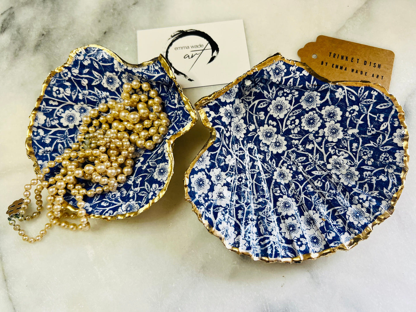 blue and white floral scallop shell dish, Dorset handmade oyster shell jewellery holder, gold leaf scallop shell trinket dish, coastal ring holder dish, sustainable scallop shell ornament, artisan jewellery dish UK, scallop shell salt and pepper pinch pot, floral scallop shell vanity tray, handmade scallop shell gift for her, blue and white coastal home decor dish, unique Dorset scallop shell trinket storage, hand gilded scallop shell decorative dish, UK handmade artisan shell gift