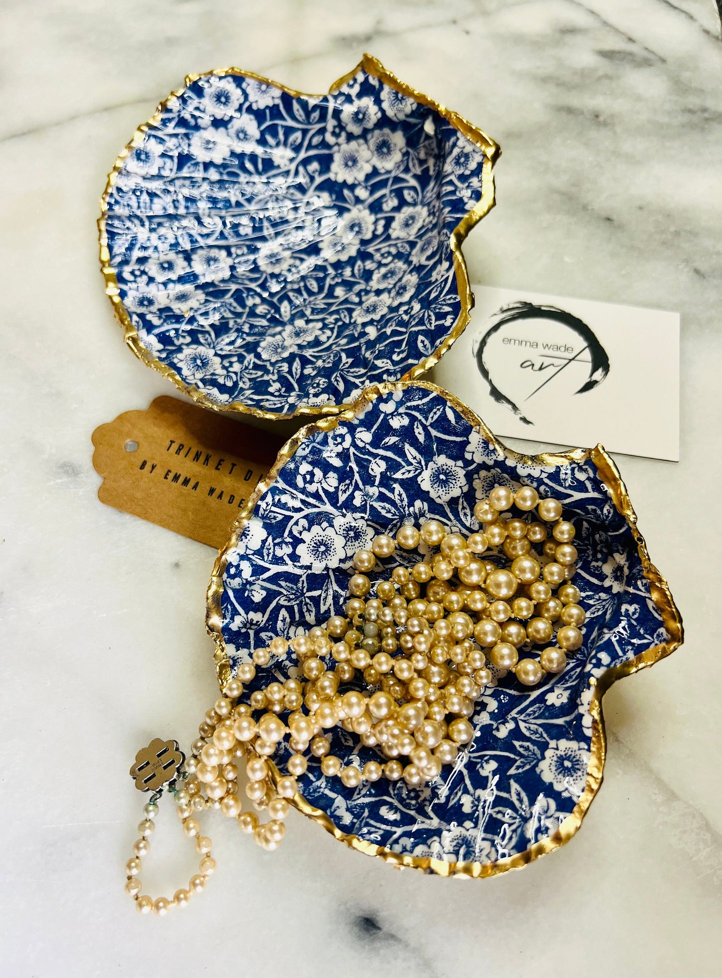blue and white floral scallop shell dish, Dorset handmade oyster shell jewellery holder, gold leaf scallop shell trinket dish, coastal ring holder dish, sustainable scallop shell ornament, artisan jewellery dish UK, scallop shell salt and pepper pinch pot, floral scallop shell vanity tray, handmade scallop shell gift for her, blue and white coastal home decor dish, unique Dorset scallop shell trinket storage, hand gilded scallop shell decorative dish, UK handmade artisan shell gift