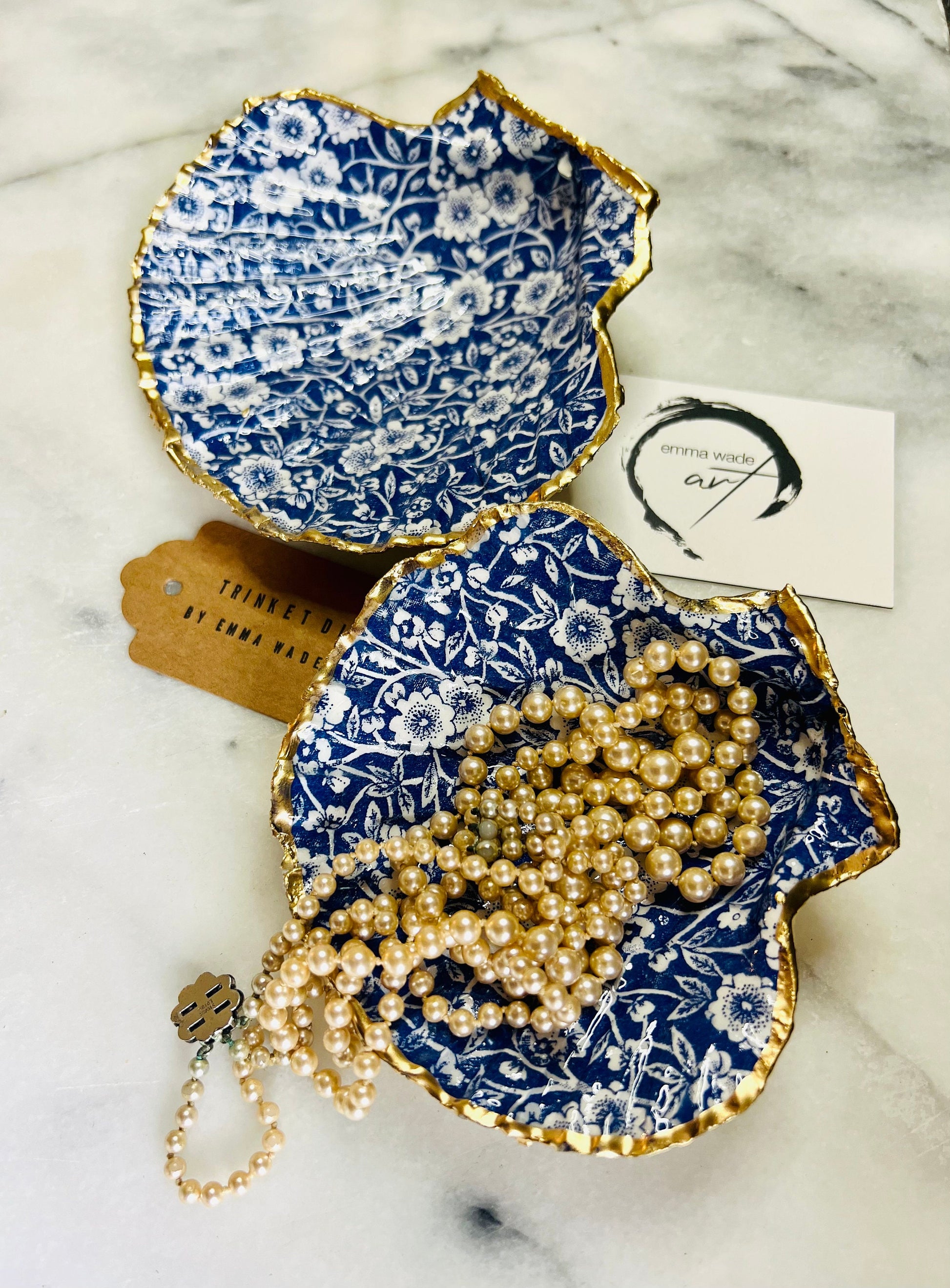 blue and white floral scallop shell dish, Dorset handmade oyster shell jewellery holder, gold leaf scallop shell trinket dish, coastal ring holder dish, sustainable scallop shell ornament, artisan jewellery dish UK, scallop shell salt and pepper pinch pot, floral scallop shell vanity tray, handmade scallop shell gift for her, blue and white coastal home decor dish, unique Dorset scallop shell trinket storage, hand gilded scallop shell decorative dish, UK handmade artisan shell gift