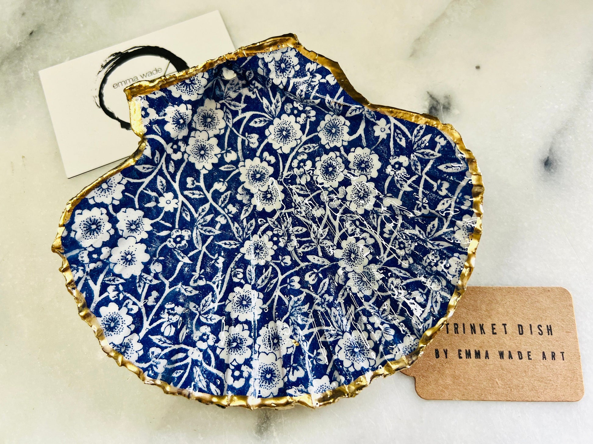 blue and white floral scallop shell dish, Dorset handmade oyster shell jewellery holder, gold leaf scallop shell trinket dish, coastal ring holder dish, sustainable scallop shell ornament, artisan jewellery dish UK, scallop shell salt and pepper pinch pot, floral scallop shell vanity tray, handmade scallop shell gift for her, blue and white coastal home decor dish, unique Dorset scallop shell trinket storage, hand gilded scallop shell decorative dish, UK handmade artisan shell gift