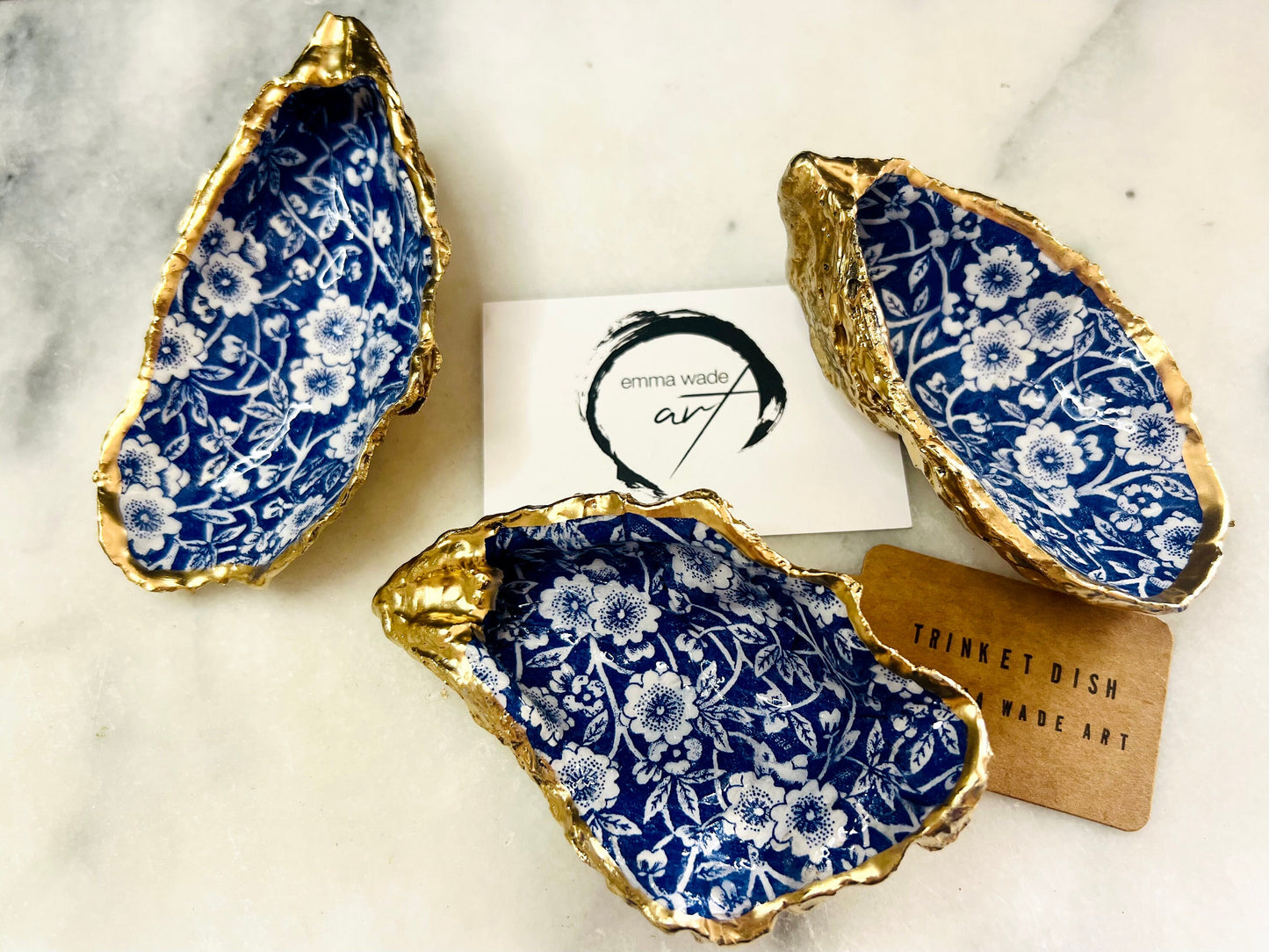 navy blue and white floral oyster shell dish, Dorset oyster shell jewellery holder, handmade coastal trinket dish UK, gold leaf gilded oyster shell ornament, eco friendly oyster shell vanity tray, unique handmade oyster shell cufflink or tie pin dish, navy floral oyster shell salt and pepper pinch pot, oyster shell spoon rest or sugar dish, floral oyster shell coastal bathroom accessory, sustainable Dorset oyster shell art, handmade oyster shell wedding or anniversary gift UK