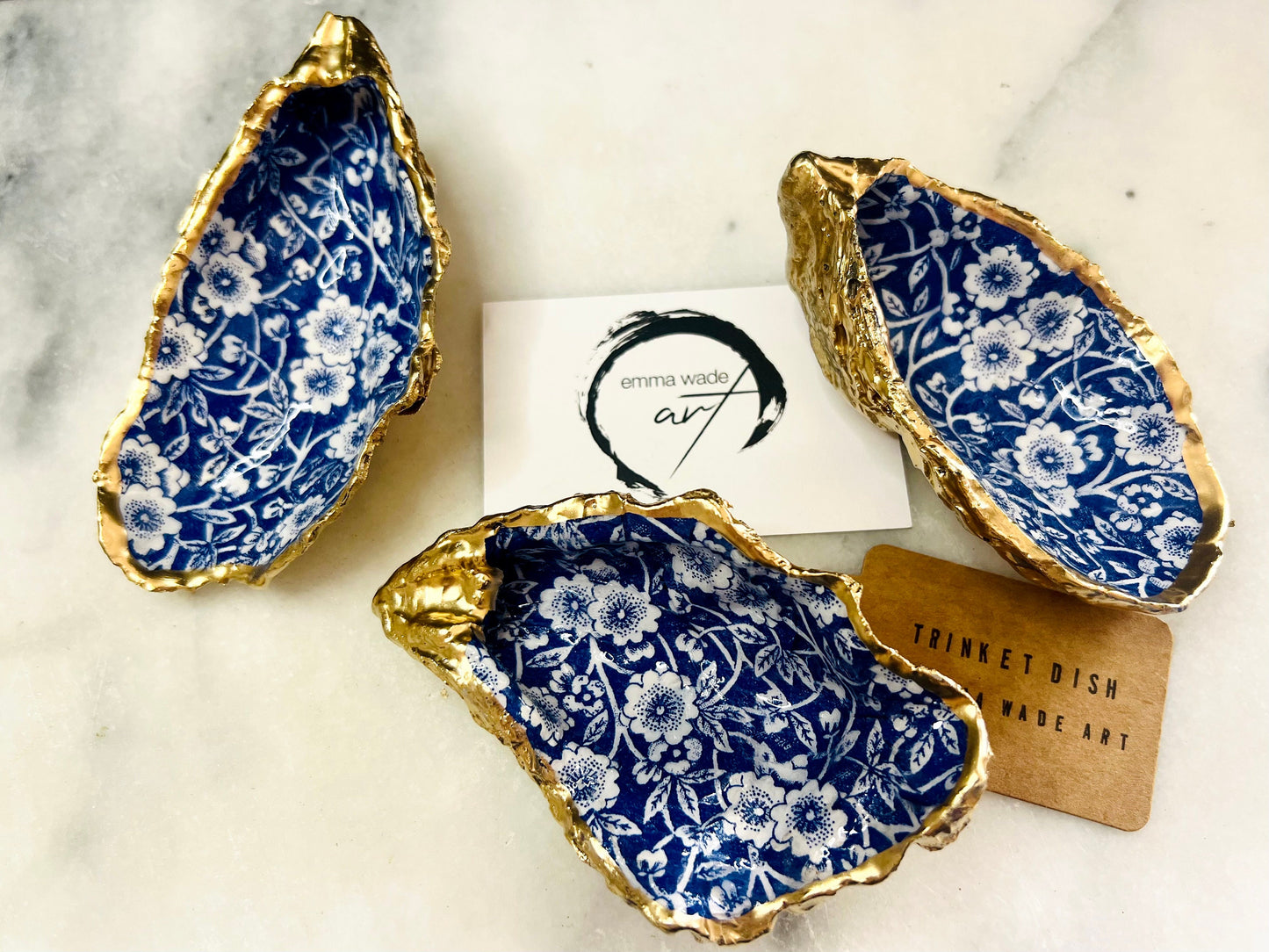 navy blue and white floral oyster shell dish, Dorset oyster shell jewellery holder, handmade coastal trinket dish UK, gold leaf gilded oyster shell ornament, eco friendly oyster shell vanity tray, unique handmade oyster shell cufflink or tie pin dish, navy floral oyster shell salt and pepper pinch pot, oyster shell spoon rest or sugar dish, floral oyster shell coastal bathroom accessory, sustainable Dorset oyster shell art, handmade oyster shell wedding or anniversary gift UK
