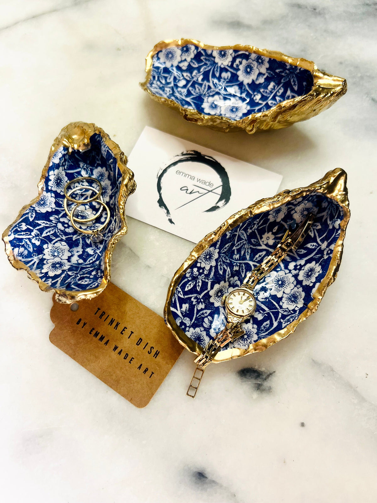 navy blue and white floral oyster shell dish, Dorset oyster shell jewellery holder, handmade coastal trinket dish UK, gold leaf gilded oyster shell ornament, eco friendly oyster shell vanity tray, unique handmade oyster shell cufflink or tie pin dish, navy floral oyster shell salt and pepper pinch pot, oyster shell spoon rest or sugar dish, floral oyster shell coastal bathroom accessory, sustainable Dorset oyster shell art, handmade oyster shell wedding or anniversary gift UK