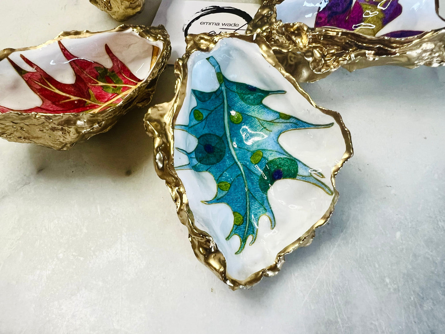 jewelled leaves oyster shell dish, Dorset oyster shell jewellery holder, gold leaf gilded oyster shell trinket dish, handmade coastal oyster shell decor, eco friendly oyster shell art UK, oyster shell bathroom tray, oyster shell salt and pepper pinch pot, leaf design oyster shell ornament, red leaf oyster shell, yellow leaf oyster shell, multiple designs available oyster shell dish, unique oyster shell keepsake, sustainable oyster shell jewellery tray, handmade Dorset shell gift