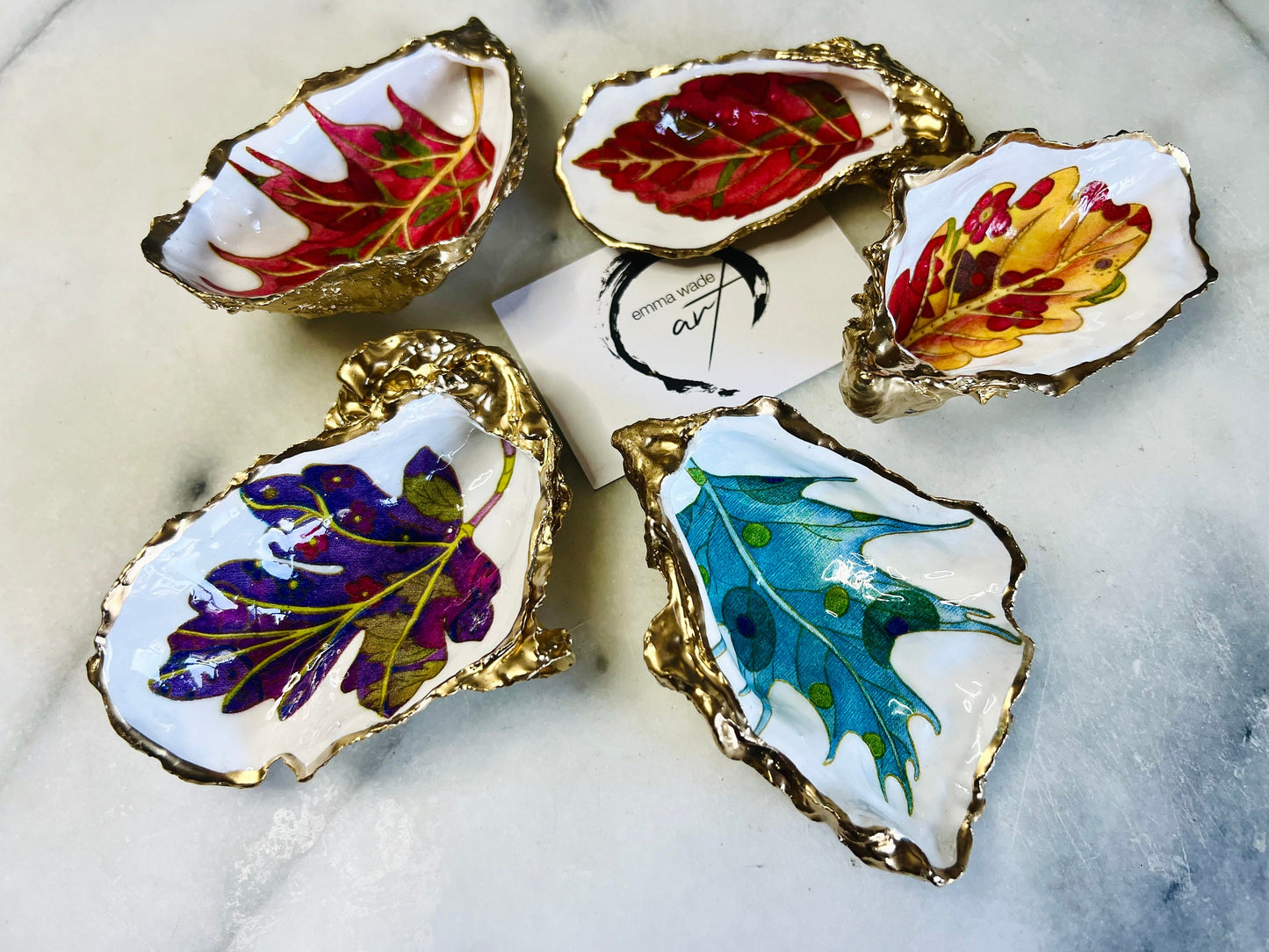 jewelled leaves oyster shell dish, Dorset oyster shell jewellery holder, gold leaf gilded oyster shell trinket dish, handmade coastal oyster shell decor, eco friendly oyster shell art UK, oyster shell bathroom tray, oyster shell salt and pepper pinch pot, leaf design oyster shell ornament, red leaf oyster shell, yellow leaf oyster shell, multiple designs available oyster shell dish, unique oyster shell keepsake, sustainable oyster shell jewellery tray, handmade Dorset shell gift