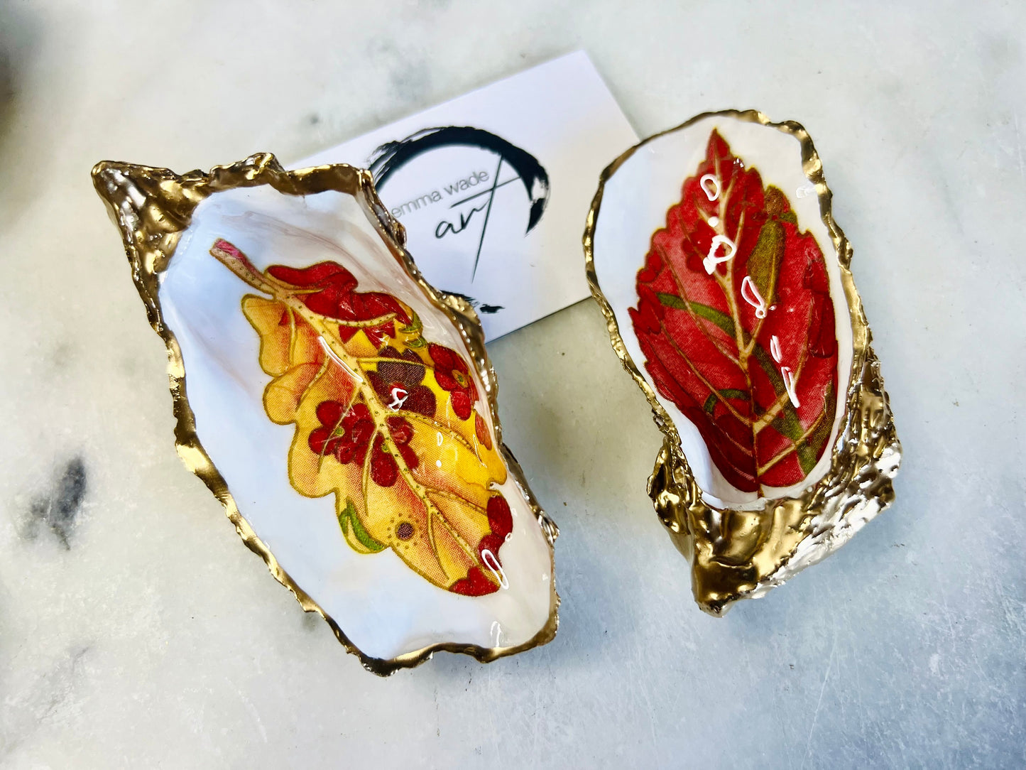 jewelled leaves oyster shell dish, Dorset oyster shell jewellery holder, gold leaf gilded oyster shell trinket dish, handmade coastal oyster shell decor, eco friendly oyster shell art UK, oyster shell bathroom tray, oyster shell salt and pepper pinch pot, leaf design oyster shell ornament, red leaf oyster shell, yellow leaf oyster shell, multiple designs available oyster shell dish, unique oyster shell keepsake, sustainable oyster shell jewellery tray, handmade Dorset shell gift