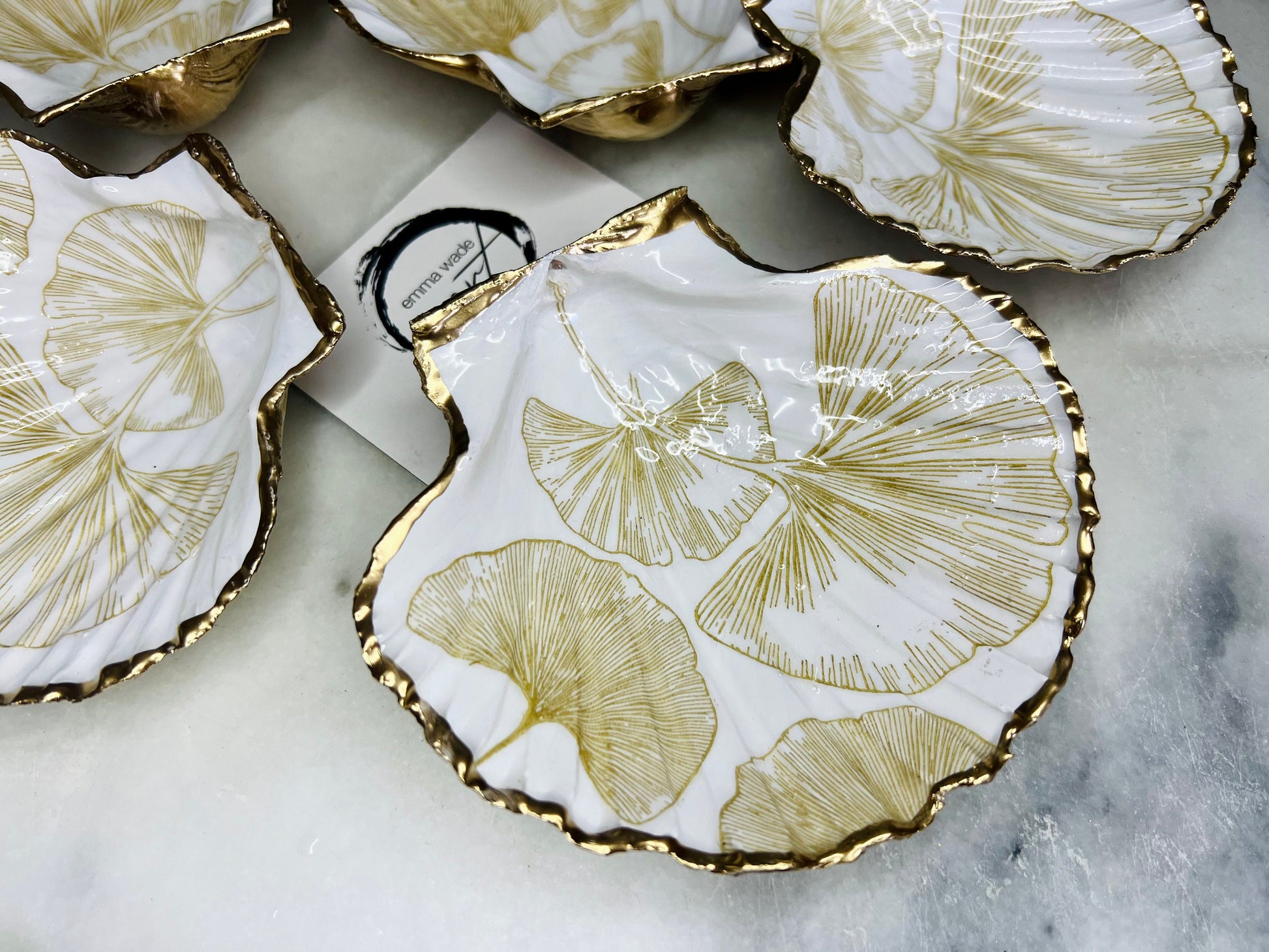 Scallop Hell Dish hand crafted with gold and white Gingko Designs, shellfish jewellery dish, UK Natural Scallop trinket tray, shell scallop dish, trinket tray shell, scallop shell jewellery bowl, golden trinket dish, decoupaged earring dish, scallop dish with gingko, decoupage shell dish, Emma Wade art, bride scallop dish, scallop shell trinket bowl, shell key bowl, gold gilded shell gift, coastal shell gift, gold white host gift, gold shell ornament, decoupage shell ring dish