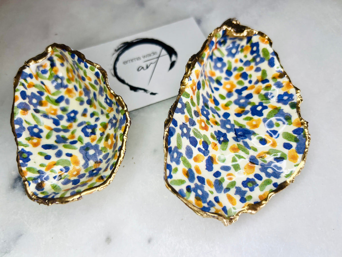 jewellery shell dish, gift for her, gift for mum, ring carrier dish, coastal decor, shell Decor, EmmaWadeART, Handmade Dorset oyster shell dish featuring Emma Bridgewater Yellow Blue Wildflower Meadow design. Finished with real gold leaf and resin. Use as a shell jewellery holder, ring dish, trinket tray, shell tray, salt pinch pot, tea light holder, or Christmas ornament. Sustainable coastal décor and unique handmade UK gift for weddings, anniversaries, or festive occasions.