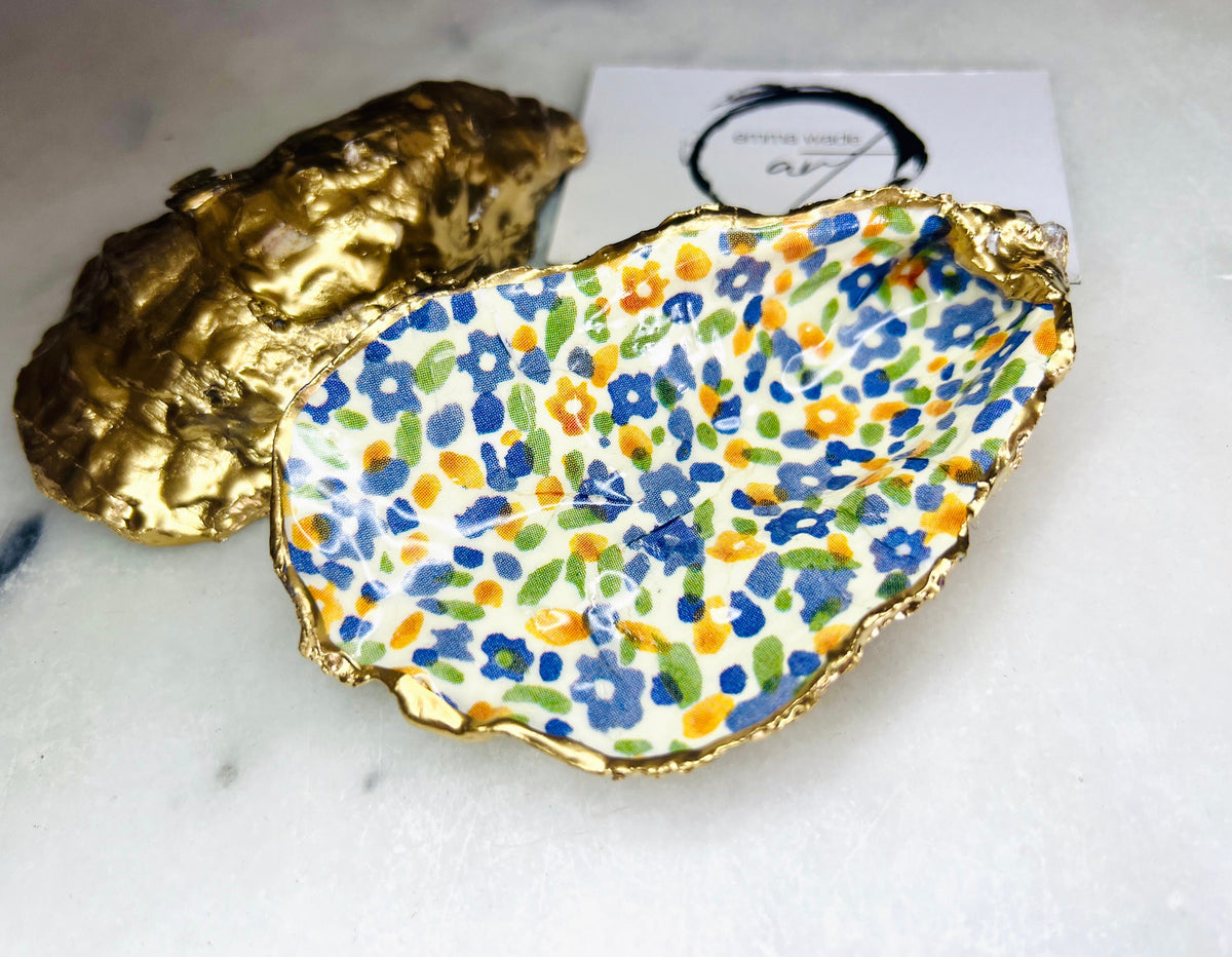 jewellery shell dish, gift for her, gift for mum, ring carrier dish, coastal decor, shell Decor, EmmaWadeART, Handmade Dorset oyster shell dish featuring Emma Bridgewater Yellow Blue Wildflower Meadow design. Finished with real gold leaf and resin. Use as a shell jewellery holder, ring dish, trinket tray, shell tray, salt pinch pot, tea light holder, or Christmas ornament. Sustainable coastal décor and unique handmade UK gift for weddings, anniversaries, or festive occasions.