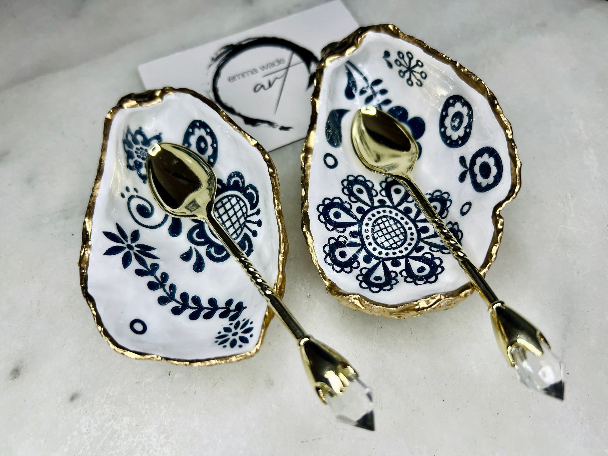 Marimekko style oyster shell salt & pepper pinch pots, Scandanavian design inspired blue floral and bird cruet dishes, UK handmade salt gift set. Pair of Dorset oyster shells, sealed with food-safe resin and finished with gold leaf edges, perfect for wedding table décor, anniversary gifts, dinner party tableware or unique coastal home décor. Sustainable handmade salt pots with optional gold crystal spoons for a luxury finishing touch.