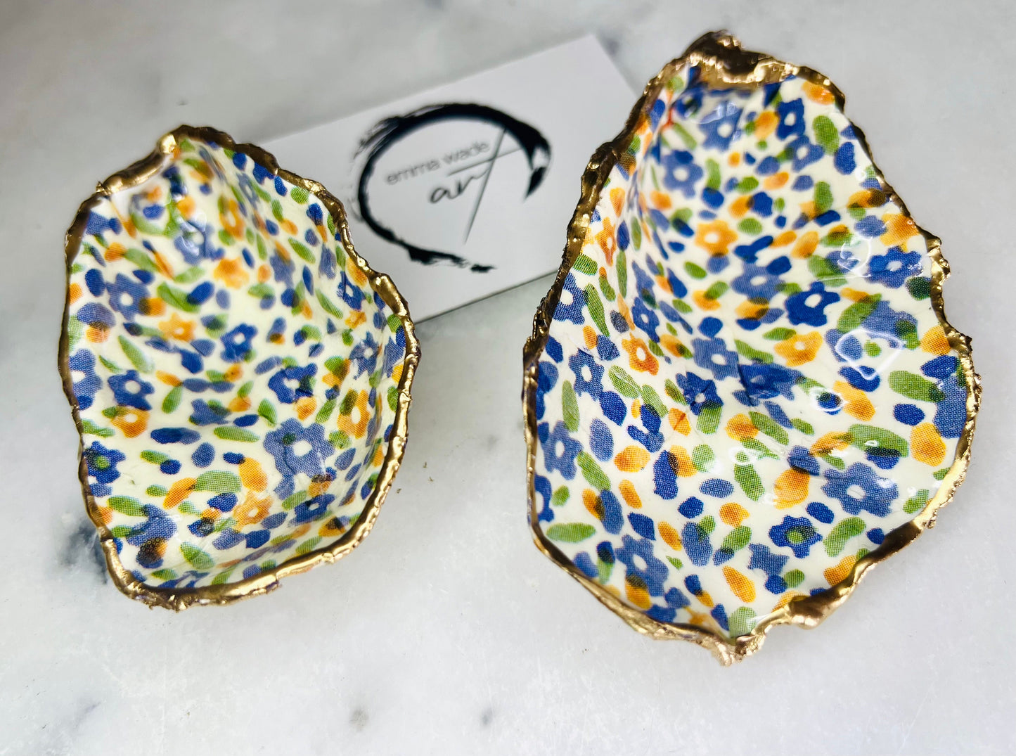 jewellery shell dish, gift for her, gift for mum, ring carrier dish, coastal decor, shell Decor, EmmaWadeART, Handmade Dorset oyster shell dish featuring Emma Bridgewater Yellow Blue Wildflower Meadow design. Finished with real gold leaf and resin. Use as a shell jewellery holder, ring dish, trinket tray, shell tray, salt pinch pot, tea light holder, or Christmas ornament. Sustainable coastal décor and unique handmade UK gift for weddings, anniversaries, or festive occasions.