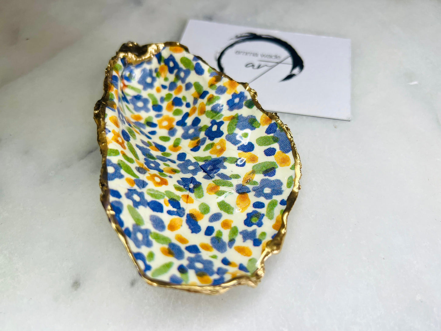 jewellery shell dish, gift for her, gift for mum, ring carrier dish, coastal decor, shell Decor, EmmaWadeART, Handmade Dorset oyster shell dish featuring Emma Bridgewater Yellow Blue Wildflower Meadow design. Finished with real gold leaf and resin. Use as a shell jewellery holder, ring dish, trinket tray, shell tray, salt pinch pot, tea light holder, or Christmas ornament. Sustainable coastal décor and unique handmade UK gift for weddings, anniversaries, or festive occasions.