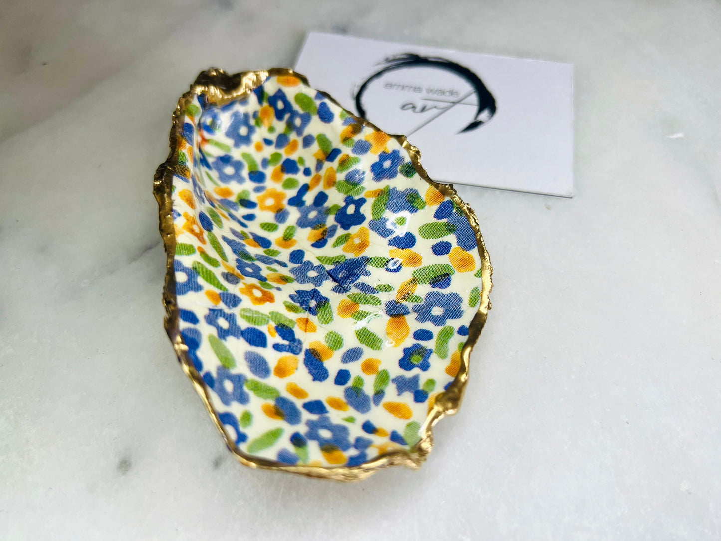 jewellery shell dish, gift for her, gift for mum, ring carrier dish, coastal decor, shell Decor, EmmaWadeART, Handmade Dorset oyster shell dish featuring Emma Bridgewater Yellow Blue Wildflower Meadow design. Finished with real gold leaf and resin. Use as a shell jewellery holder, ring dish, trinket tray, shell tray, salt pinch pot, tea light holder, or Christmas ornament. Sustainable coastal décor and unique handmade UK gift for weddings, anniversaries, or festive occasions.
