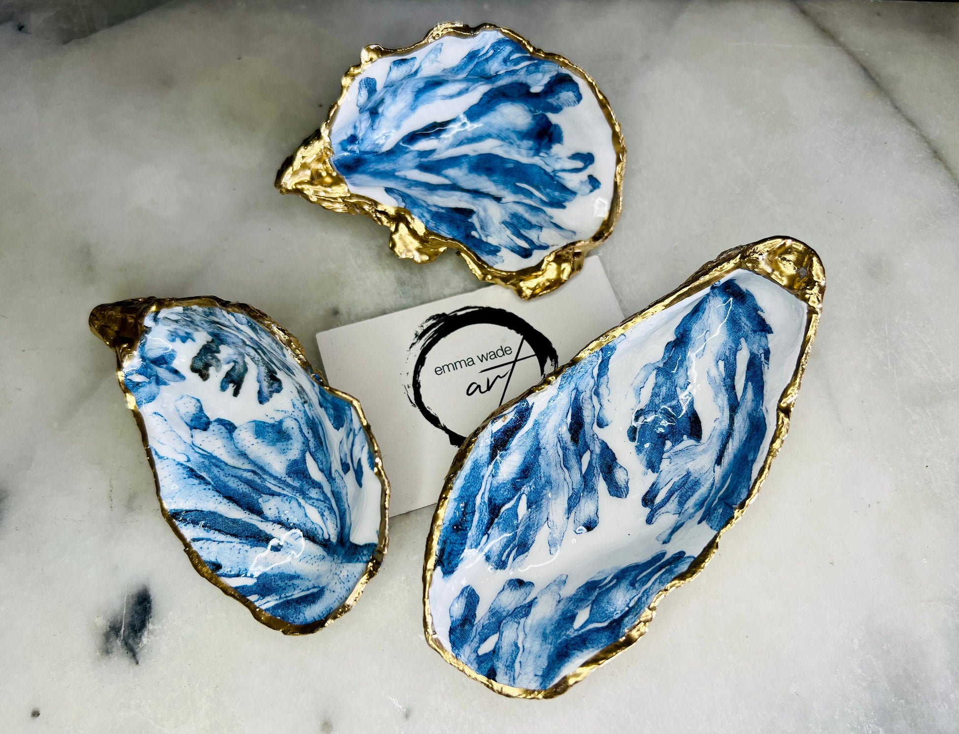 Trinket dishes gold finish, shell jewellery dish, navy and gold trinket tray, shell scallop dish, trinket tray shell, she dreams of the sea, shell jewellery bowl, golden trinket dish, oyster shell blue seaweed, blue and gold dishes, decoupaged earring dish, oyster dish with coral, shell art trinket, decoupage shell dish, Emma Wade art, bride oyster dish, oyster shell trinket, shell key bowl, shell coral dish